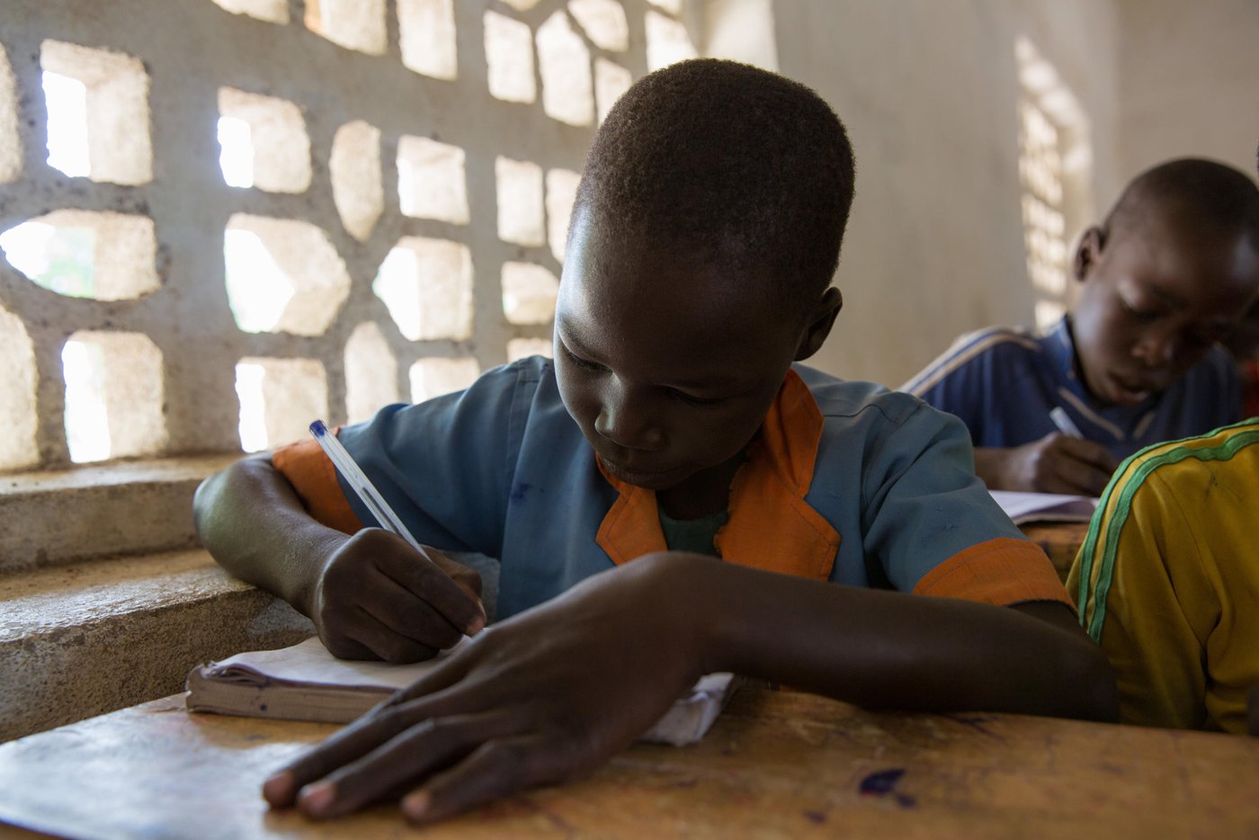 "My father tells me I have to go to school," Lawan says shyly. His father is a teacher in another village but Lawan has four siblings in the same school, and has safety in them. He is in class five now, listening carefully to his teacher Adamou. He likes the French classes the best. With his birth certificate he can stay in school, unlike some of his close classmates who can only attend one more year before they lose their right.
Just a few days earlier Boko Haram attacked the village at night, looting the villagers, but not killing anyone this time. Most of Lawan's classmates are internally displaced already, and come with their own memories and scars. When the conflict follows them to where they fled to safety, life can feel pretty fragile.
This Wednesday, 42 students are absent from class. They should have been 95 in total. This is far above the average national level of 60 students per class. Adamou, the teacher, knows that several families fled the village after the attack and some have yet to return, while others stay at home in fear.
Photo: Ingebjørg Kårstad/NRC
