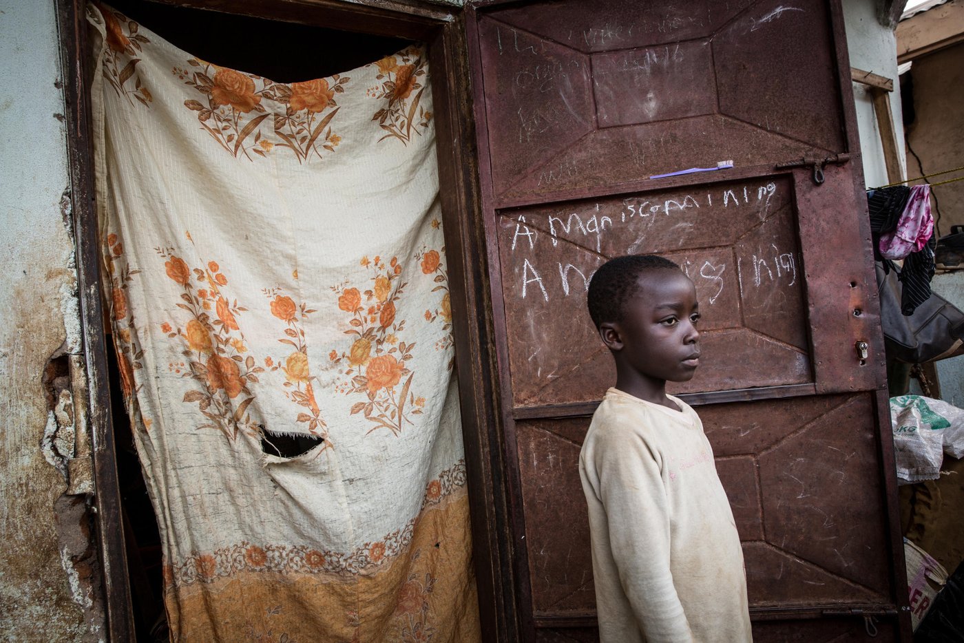 Alliance's son, Brandon, 9 years old.
“When I first came here, I considered myself a dead person. I could not contribute. I had to ask people for help all the time. I felt that was the end of my life. I asked God – How could you give me twins in these times of conflict? I did not know I could live like this, even for a week! But I adapted. I have accepted my situation. I have to”, Alliance, a displaced in Bamenda tells us.
“When the crisis started I was pregnant with twins, close to giving birth. My husband ran for safety into the bush, and I went to the hospital. I had to stay there for three weeks after my C-section. No cars were moving because of the fighting and prices were high. There were gunshots everywhere! I had to breastfeed at night in complete darkness because it was too dangerous to turn the lights on. After a week like this, my husband wanted us to flee to Bamenda”, she recalls.
Alliance, her brother and sister, her mother, grandmother and her husband, and their 6 children, arrived to Bamenda one and a half years ago. Since then, they have moved around and tried to find a place that could fit them all. After some time, her mother and grandmother chose to return to the village despite the dangers. Two of her kids lives with her husband’s brother so they can go to school, and the oldest one lives in Yaoundé. The family had to split, like so many others.
Back in Belo, she used to work as a hairdresser. She had loyal customers, and a good income.
“When we fled I managed to bring with me some mesh and hair extensions. I thought it would be useful so I could work in Bamenda as well. But, when we arrived here we had nothing to protect us from the cold concrete floors, so I had to use them for my twins to sleep on. They were damaged by baby pee. Now I know that my salon is burned down, so I cannot go back and get more. I lost it all. Here in Bamenda I struggle to find customers. Nobody knows me and I don’t think people want to come to this room to get their hair done, but I don’t have money to pay rent for a salon as well”, she sighs.
The biggest struggle is to find enough money to buy food for the family. Her husband is working on a minibus and is now temporarily back in Belo to try to find some food. “Some days we have food, some days not. For tomorrow, don’t know what will happen. Maybe some rice. I don’t know. If we have just a little, only the small children eat. I have lost a lot of weight”, Alliance says.
From NRC, the family has received a NFI kit, with mats, blanket, mosquito net, ropes, tarpaulin, jerry cans, soaps, torch, umbrella, pots, kitchen utensils and a menstrual hygiene kit.
Two times Alliance has been back in Belo; for her father-in-law’s funeral and one time when they were desperate for something to eat. Since men are more often the target of killings in this conflict, she took her twins since she was breastfeeding and started the risky journey. First with taxi and then on foot. “I hiked for four hours with my young twins through the bush and along the road. It was very unsafe, but we desperately needed something to eat. It was gunshots all the time”.
The road has many checkpoints and the separatists have been digging trenches in the road to block cars from travelling. Bribes are often demanded to pass. Back in the village, Alliance found some crops that were not stolen and returned to Bamenda with food.
The scars of war are sitting deep in her young children. “When my children hear gunshots, they start to cry and run inside the house. They pee on themselves. I carry them, I tell them it will be over soon.”
Photo: Ingebjørg Kårstad/NRC