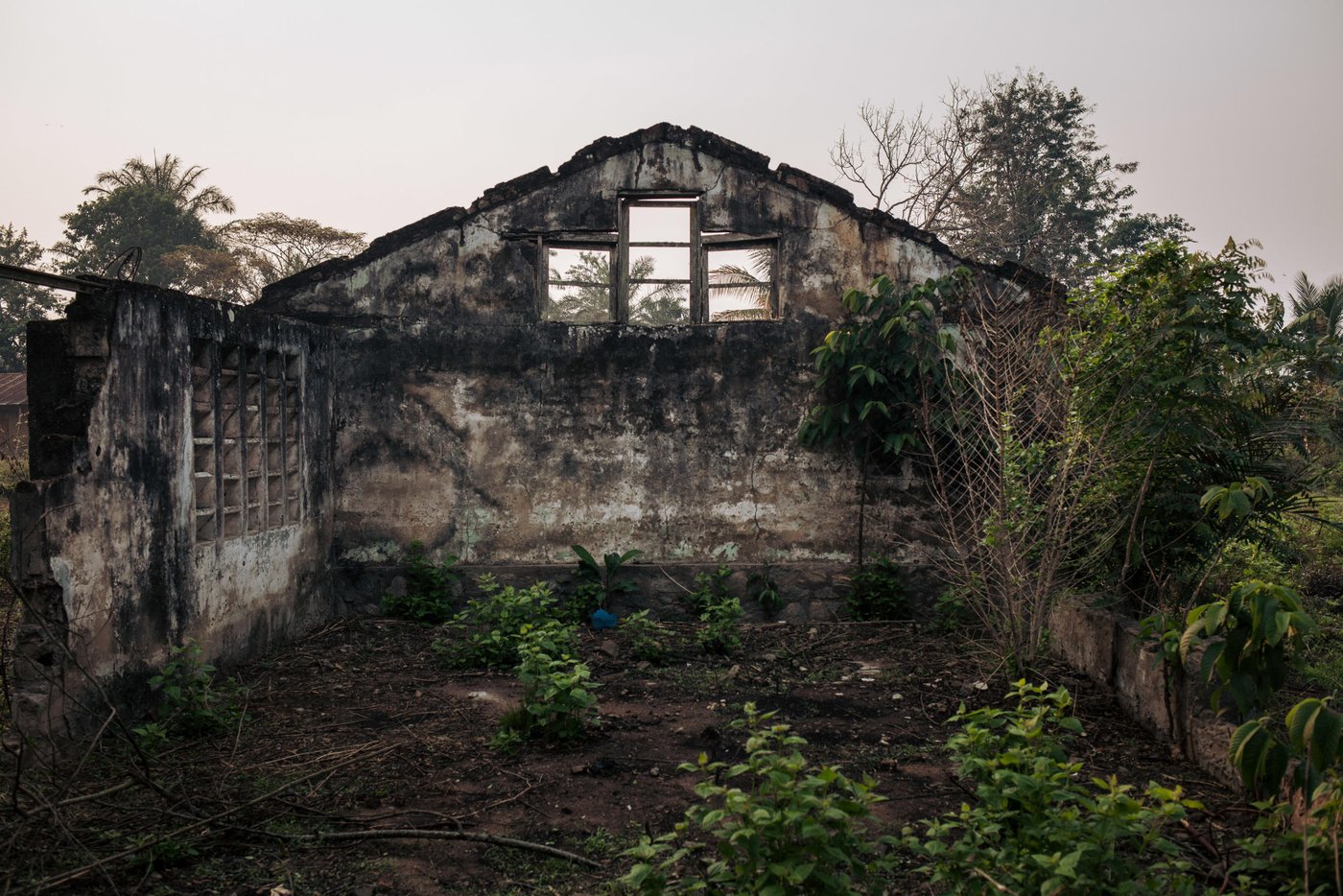 View of the ruins of an administrative building in the village of Mbulungu. In early 2017, armed militias took control of the area. They systematically destroyed official buildings and attacked government officials. 

Over 1 million people have returned to their homes in Kasai-Central after a year of violent conflict within the province and across the Greater Kasai Region.  Unfortunately, people who have returned have found their homes and fields pillaged and burned to the ground.  These farming communities have no shelter, no food to eat and no means of sustaining any viable livelihood.

Earlier this year, NRC visited Mbulungu and Bakuakashila, two villages ravaged by the regional conflict in 2017.  NRC used its “community-based approach” by consulting with these communities to better understand their primary needs, to properly target the most vulnerable people and facilitate their ability to choose the assistance they require.

This intervention, however, is only a drop in the ocean of the vast needs of this community.  NRC is currently the only humanitarian actor in the zone and funding is not enough to address other acute needs such as food assistance, household items and education.  The Humanitarian Response Plan is currently only 25 per cent funded eight months into the year.  Humanitarian capacity is critically low.  If donors do not act now for the people of Mbulungu and for the rest of DR Congo, it will be too late.

August 29, 2018 - Kasai-Central Province, DR Congo 
Photo: NRC/Aléxis Huguet