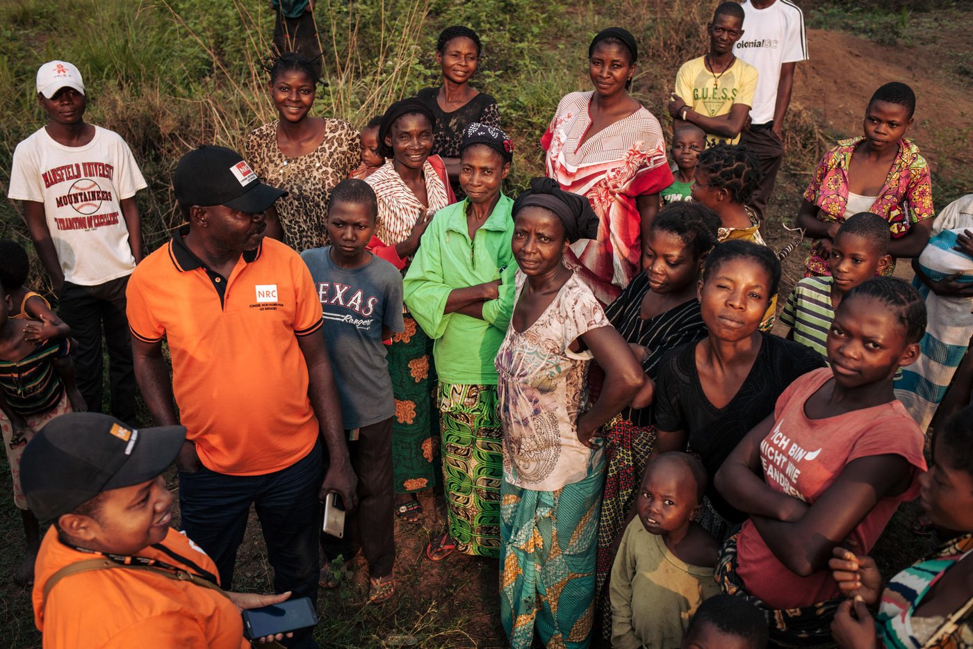 NRC team meeting with residents of Mbulungu village. 

Nearly 17,000 people—or close to 95 per cent of Mbulungu’s population was forced to flee into the forest when fighting broke out between armed groups in March and April of 2017.  Some had to walk up to seven days to find a safe place to hide.  Many lost family members, were assaulted and nearly starved to death while on the move.  All lived in horrific conditions not certain of whether or not life would ever return to normal.

Though calm has returned to Mbulungu and several villages and towns just like it across Kasai-Central, people are not able to continue their lives as normal.  The violent conflict of 2017 left mass destruction in its wake—homes, markets, schools, sanitation facilities and health infrastructure in complete disarray.  In fact, 67 per cent of families living in Mbulungu do not have access to proper latrines and 55 per cent have no access to soap.  These absence of these basic necessities coupled with malnutrition and lack of proper shelter can lead to a host of diseases and death.

For that reason, NRC visited Mbulungu, in early 2017, where they met with the community to understand their primary needs.  NRC used its “community-based approach” by consulting with these communities to better understand their primary needs, to properly target the most vulnerable people and facilitate their ability to choose the assistance they require.

This intervention, however, is only a drop in the ocean of the vast needs of this community.  NRC is currently the only humanitarian actor in the zone and funding is not enough to address other acute needs such as food assistance, household items and education.  The Humanitarian Response Plan is currently only 25 per cent funded eight months into the year.  Humanitarian capacity is critically low.  If donors do not act now for the people of Mbulungu and for the rest of DR Congo, it will be too late.

August 29, 2018, Kasai-Central Province, DR Congo. 
Photo: NRC/Aléxis Huguet