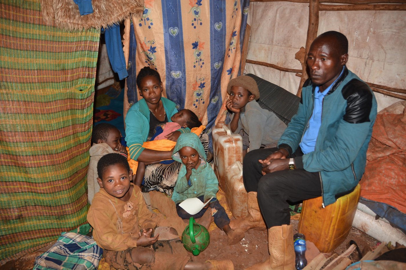 “I have been displaced twice. The first time was in April 2018, when a conflict began in our village and a group of youth destroyed the roof of my house. After few months, the government told us to go back home but when we returned, everything we owned was destroyed. The security was still fragile, so I fled again,” says Abraham Dube 34-years-old farmer remembering what happened a year ago.
Abraham was born and raised in Sere Seba Kebele of West Guji. During the conflict, he was forced to walk for six hours with his wife and five kids. He currently lives in an IDP site called ‘Spring site’ with about 3,800 other IDPs.
Before the conflict, Abraham and his wife owned a coffee shop. He also cultivated coffee, false banana and maize. “We were living a good life. I was earning more than 10,000 Birr ($357) a year. Now we have lost everything, they burnt our coffee shop and farm,” explains Abraham.
Photo: Tinbit Amare/ NRC