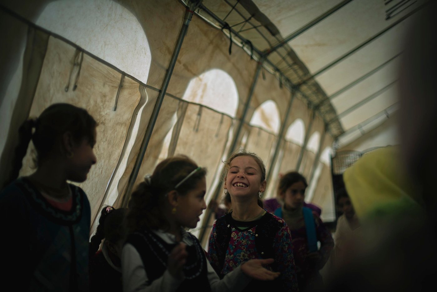 Children who have been recently displaced have missed up to two years of important social and intellectual development. They may have been forced to attend IS schools, or not attended school at all. It's vitally important to return children to a safe, protective environment as soon as possible when they reach emergency sites so that they can receive life saving messages such as hygiene promotion and mine awareness.
NRC provides psychosocial support to help children cope with their new surroundings and any traumatic events they may have experienced. Through our Better Learning Program, we teach children deep breathing and stretching techniques that reduce stress and help improve focus. BLP also uses art as a way for children to process the events they've experienced in a positive manner, which has been proven to reduce things like nightmares and negative behavior in the classroom.
NRC's School Support Center provides a safe space for children to play, learn and grow. Instructors have receive training in how to work with conflict-affected children, and they tailor their games and activities to engage children in their new environment. Children play sports, engage in music and art activities, and also receive basic education classes to help prepare them to go back to school.
Photo: NRC/Hussein Amri
Debaga Camp in Iraq