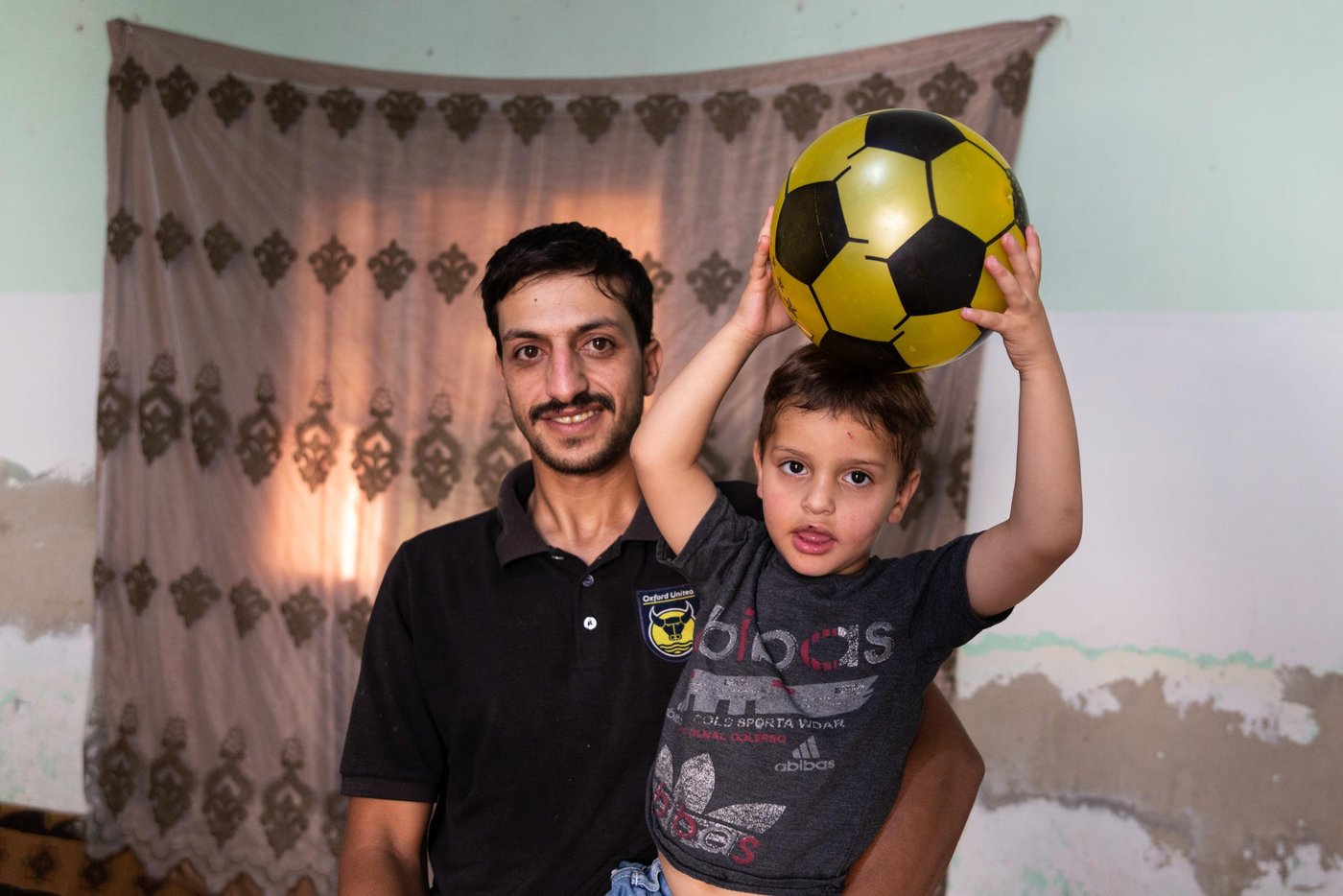 Muhammad poses for a picture with his eldest son Bassam.
“I thought that I would come to Jordan for a month, two months...a year or two, but I have stayed here to this day. Now there is no hope of returning to Syria. Our city Homs was badly destroyed, our house was levelled because of the bombing”
Muhammad is a Syrian refugee from Homs. He fled Syria in 2012 to Jordan and now lives in Mafraq city in northeastern Jordan. Muhammad never thought that he would be a refugee in Jordan drying bread for a living, which is the only option he now has to provide a simple income for his family.
Capture date: 26/09/2021
Photo: Sherbel Dissi/ NRC