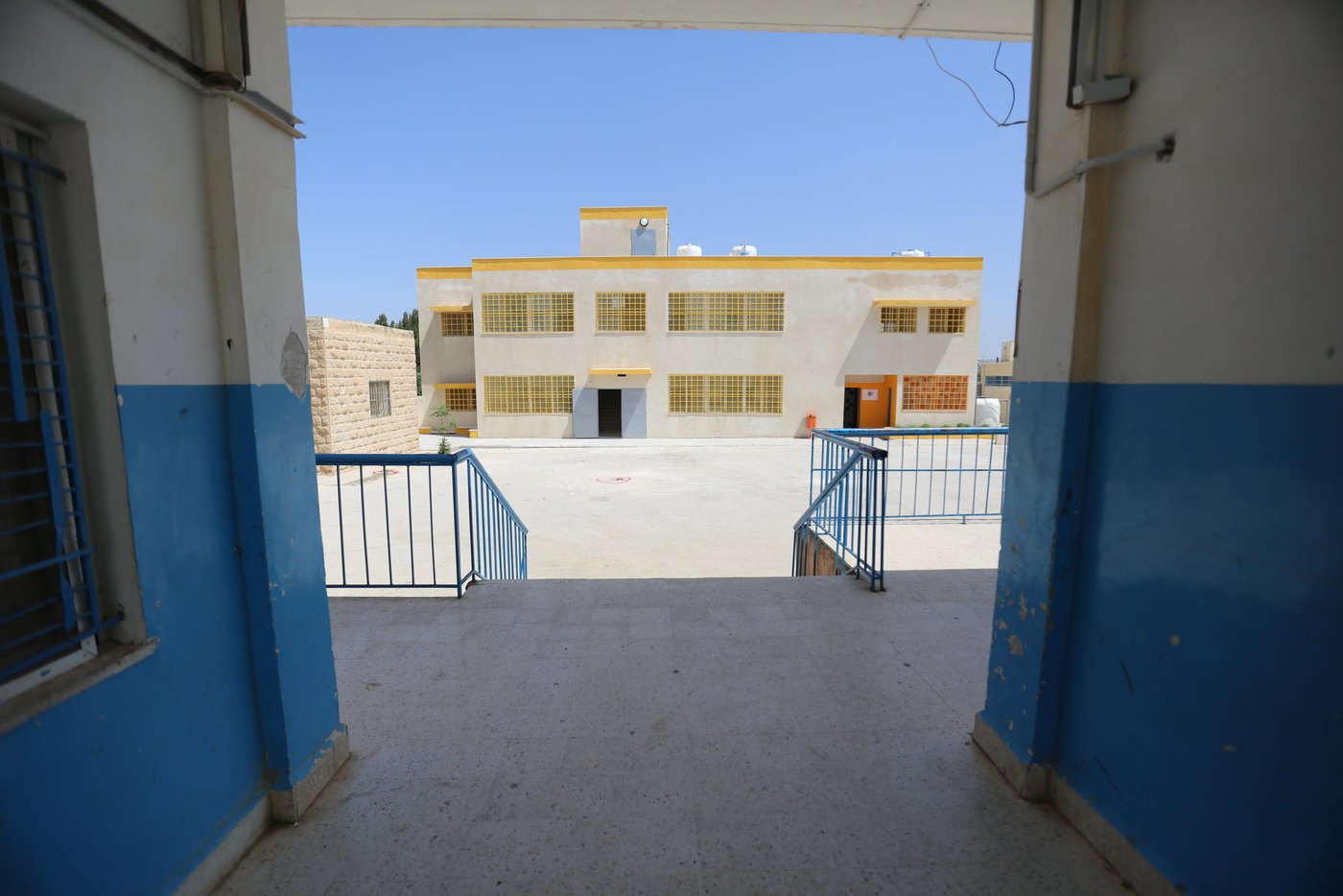NRC has developed an education programme for local schools with a high rate of Syrian refugee students.
Through this project, developed together with the Jordanian Ministry of Education and funded by the Norwegian government and UNICEF, NRC is working to help expand overcrowded school. We’re supporting construction work and are collaborating with schools’ management teams to address the specific challenges they’re facing with this influx of students.
In total, the project has helped expand five schools throughout Irbid. It is alleviating some of the pressure off schools by reducing the number of students per classroom, and enabling both Syrian refugee students and Jordanian students to go to formal schools, often nearer to their homes, instead of commuting to farther schools.
These five schools in Irbid now boast 40 fully furnished classrooms, six sanitation facilities and six playgrounds. In total, the project has created 1,440 spaces for new students.
Photo: Hassan Hijazi/NRC