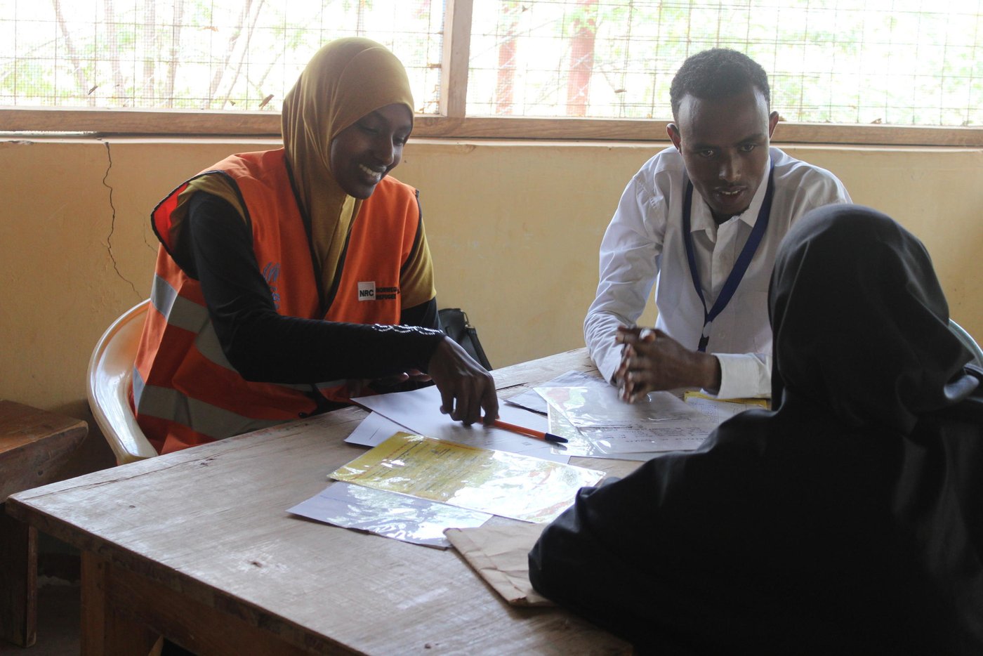 The ICLA team provides counselling and or information depending on what the client is seeking. ICLA project assistant Safo Ahmed provides counselling for a refugee on legal and civil documentation
Photo by : NRC/ Jean Ndede