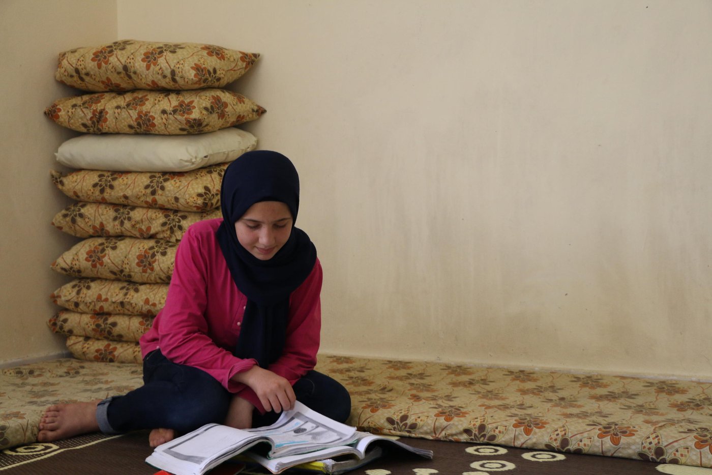 Rasha, 14, a Syrian refugee in Lebanon
Many good things would happen if the war had never happened in Syria. We could have made a change in Syria and in the society, but now we have no other choice than to wait until the war is over. Only then we can make a change in Syria.
I miss everything about Syria, our house, the school, my friends, and my grandparents.
I used to get along with everyone in Syria, and I feel at home among the people from the same country.
I like travelling, because I like to meet new people, and discover new cultures and countries. I like to live in Canada, I always check photos on google about Canada and I like the place there very much. I’d like to visit it one day.
I would like to create a YouTube channel with my sister, where we publish entertaining content so people can watch.
I like reading, I read online because we’re not able to buy books very often. I like novels very much. I like writing as well, I always get a high score on writing. I feel it is easy because I enjoy doing it. I find it easy because I read a lot and I watch lot of YouTube videos about different subjects.
I want to become a dentist in the future, or a journalist because I like taking photos. I wish the war ends in Syria and we can go back to our country, and my siblings and I can fulfil our dreams.
Photo: Nadine Malli/NRC