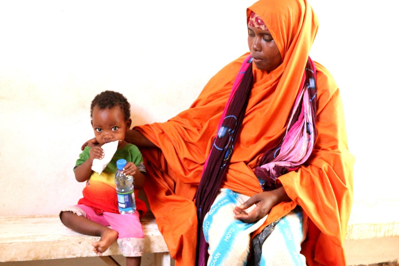 In early 2018, Khadija Mukhtar and her five children fled their home in Somalia due to prolonged droughts. They made the long and rough 217 km journey all the way from their home in Bardale to Baidoa town, the capital of the Bay region, in search of food and water.
Khadija’s husband divorced her when she gave birth to her first child , leaving her struggling to feed her five children alone.
During the long journey to Baidoa, access to food and water was very limited. At some points, Khadija wasn’t sure if they would make it.
“The trip was never easy,” says Khadija. “I still remember the moment we stayed without food and water for a whole day. I didn’t have money. I didn’t have anything else to feed my children. I stopped at every village we passed to ask for food and water for my children.”
“I felt like my baby was dying”
Khadija and her five children now live in Hanano camp for the internally displaced in Baidoa town. She earns a very small income through casual work which is not enough to feed her five children. Khadija’s baby daughter, Fatima, became sick and severely malnourished.
“I felt like my baby was dying. She became weak,” recalls Khadija. “She was not eating anything. I felt awful, but I didn’t know what to do. I didn’t have money to take her to hospital. Fortunately, I heard one of my neighbours saying that there’s a health centre in our camp for sick children. I didn’t hesitate. I ran immediately to the health centre.”
Khadija arrived at the maternal and child healthcare centre in Baidoa, supported by the Norwegian Refugee Council through BRCiS consortium. Eleven-month-old Fatima was found to be severely malnourished, weighing less than 6kg.
After the diagnoses, treatment began immediately and her condition started to improve. The baby regained her appetite and she began gaining weight. After ten days as an inpatient, Fatima was discharged from the stabilisation centre to continue with the outpatient therapeutic programme (OTP) for three months where nutrition services are provided.
“I am happy with the immediate treatment and the help my daughter received from the health centre. I was not expecting to receive this. My daughter got the help she needed just in time.
Thank you to everyone who contributes to this much needed health service.”
***
Thanks to the funding support from the UK’s Foreign, Commonwealth and Development Office (FCDO), the maternal and child healthcare centre provides urgent treatment for children suffering from severe acute malnutrition. For some children who are very ill, like Fatima, this treatment saves their lives.
About the BRCiS Consortium
The Building Resilient Communities in Somalia (BRCiS) Consortium was created in late 2013. It was founded by a small group of people who had been working in Somalia in 2011 and had seen the famine unfolding before their eyes. The famine took a huge number of lives and pushed Somalis to the limit in their struggle for survival amid one of the world’s longest and deepest crises.
Somalia and the international community had clearly been caught off-guard. As a result, the UK’s Foreign, Commonwealth and Development Office, one of the country’s main humanitarian donors, decided that they would change the way they funded aid in Somalia. They committed to multi-year, flexible interventions, supporting the capacity to adapt to change and reduce risks. Thus, the BRCiS story began.
Four years of resilience building in Somalia has taken the BRCiS Consortium on a rich learning journey. The BRCiS approach is based on the principle that resilience programmes must be informed by the people they are designed to serve. We aim to stand by communities during hardships and offer a certain degree of protection, while promoting self-reliance and dignity.
This inclusive approach has led to impactful and sustainable programmes with a high level of community acceptance, that address local challenges and deep-rooted vulnerabilities.
Photo: Mohamed/NRC