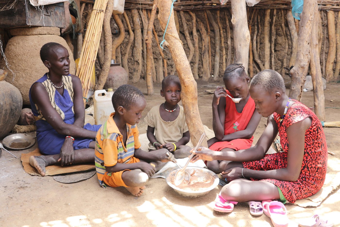 Finally Kugar has secured a meal for today for her 4 children. They are eating a porridge made of water lilies. they are inside their home.

Mother: Kugar, 36 years Old
1st born; Nyepuke, 15 years old girl.
2nd born; Nyibol, 13 years old girl.
3rd born; Jieijor, 7 years old boy.
4 th born; Nyeyione, 5 years old girl.

Photo: Ingrid Prestetun/NRC