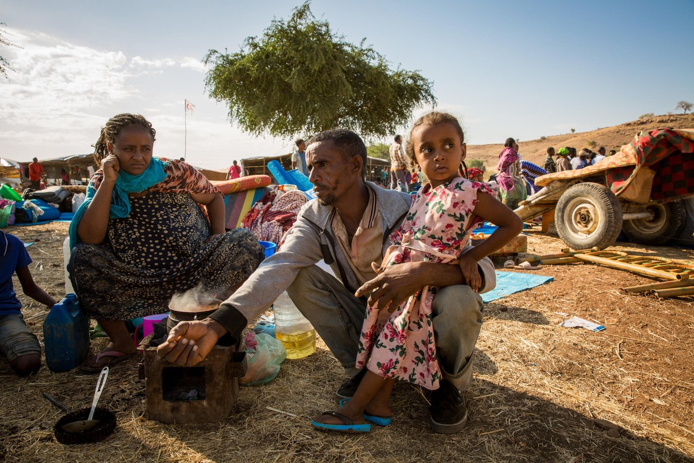 Leilti (30), her husband Gebreyesus (42) and their daughter Lela (3) are tired after their first night sleeping under the open in Um Rakuba camp. They arrived with the rest of the family of five the day before and are waiting together with a big group of new arrivals close to the entry of the camp. Leilti is five months pregnant, and found the journey to Sudan very hard.
"I wish I don't have to give birth to my baby in this place, " she tells NRC.
Photo: Ingebjørg Kårstad/NRC