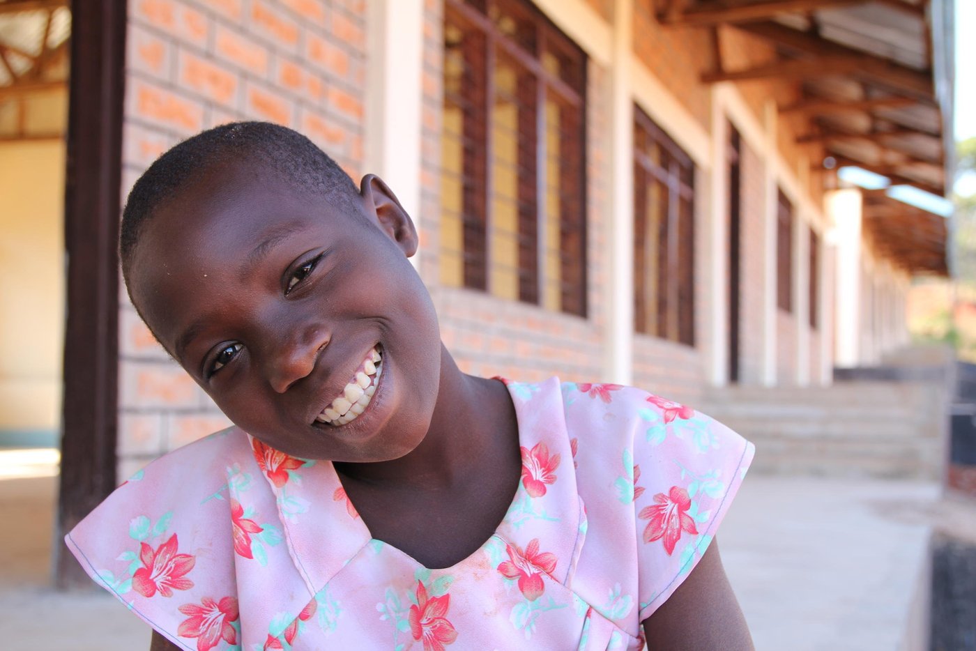 Diane (10), left Burundi while in Class Three at Kumwumi Primary School. However, while at Mtendeli refugee camp in Tanzania, Diane has not been able to resume school. She lacks the basic learning materials. “I do not have clothes, shoes, books, pen, ruler and a school bag,” she says.
However, Diane is excited about the prospect of returning to class. She is one of the pupils who will start schooling at the primary school being constructed by NRC in Mtendeli.
Diane quotes (from June 2017 interview):
“In Burundi, I liked to study. I had materials: clothes, shoes, exercise books, rubber, pencil, mathematical set, pen, shoes and body lotion.”
“We had a charming teacher who made us laugh. The school was built well and I had a friend.”
“In Burundi, I had a friend. I miss my father. I miss my friend. I miss my teacher who made us laugh. I miss my home.”
“What made us flee was political warfare. People were killed, taken at night, we could not know where they had taken them. Even my father, they took him at night.”
“In Burundi because there was a selective war, I stopped school for one year. I see they are building schools here. I pray that I also study here.”
“In Burundi, I likes Mathematics, Kirundi. I want to teach. I want to become a teacher too.”
“At school in Burundi, I likes Mathematics, Kirundi. I want to study. I want to become a teacher too.”
“In school, I likes Mathematics, I liked Kirundi, I wanted to study very hard so that I become a teacher too.”
“I see they are building the school there. I am happy because they are building. I will also go to study there to get knowledge.”
“I am hoping I will also be taken to study at that school.”
“I am happy because I see they are building the school and I have been selected to study from that school.”
“Thank you for listening to my story.”
“I hope I will get teachers who will make me laugh like those that I had in Burundi. I hope I will get friends as those I had in Burundi.”
Lyrics of her song: “When Petro was still young, he saw other children going to school, he escorted them. On the way he turned back, while very sad, then he told his parents, to bring him to school. When he started school, he did not delay to finish, and now he succeeded, he is teaching other pupils. He is teaching other pupils.”
Photo: NRC/Ingrid Prestetun