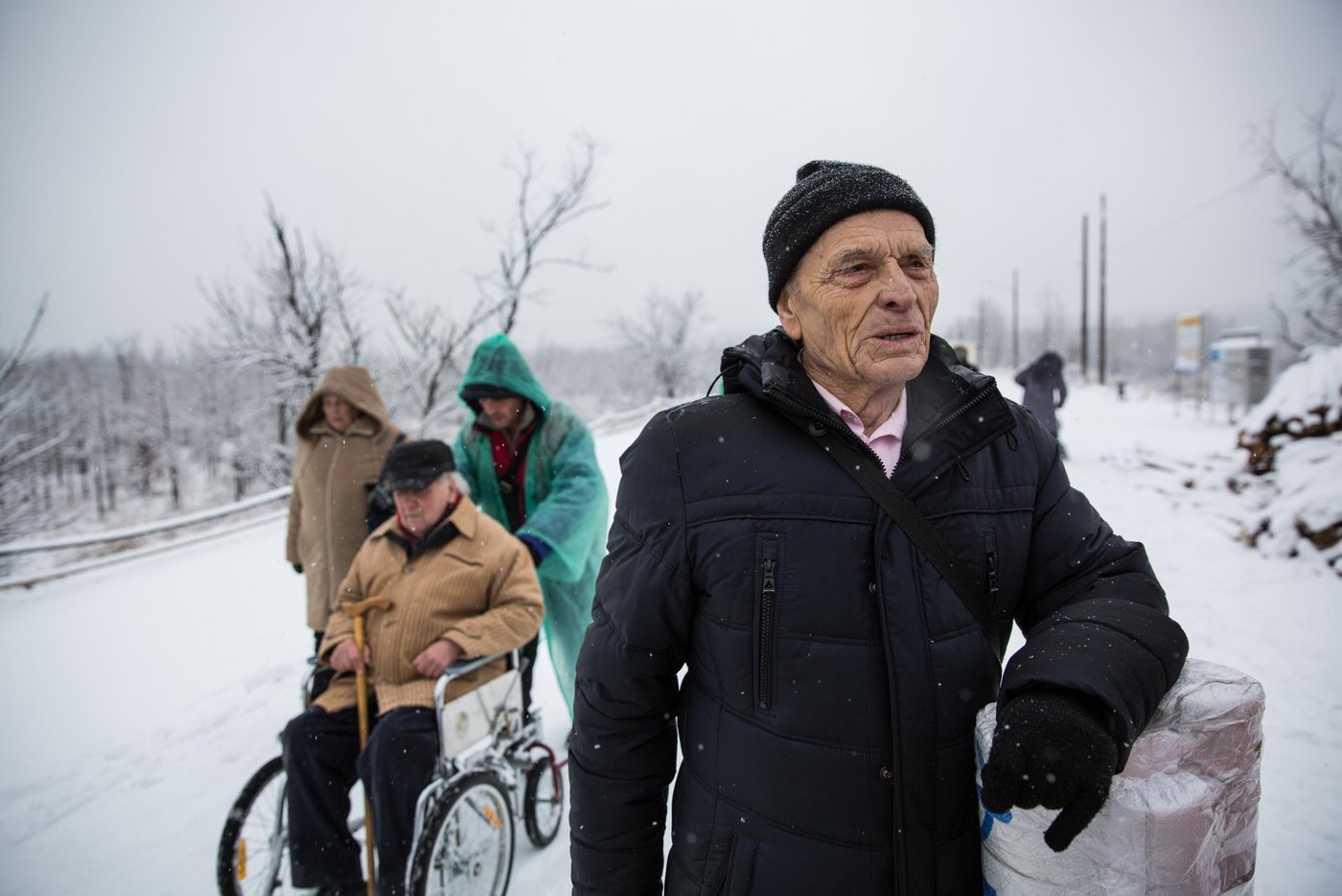 Mykola is 65. He is a pensioner from Pervomaisk in Luhansk region, now in the non-government controlled area (NGCA). He travelled from Zolote town with his wife already at 3 o'clock in the morning in order to have time to arrive at the EECP by the opening and as soon as possible move on to NGCA and get home. Mykola and his wife had waited for their turn to check their documents for about two hours.
“It has become quieter. There is less shelling. It is possible to live. But sometimes it is very scary. Children and grandchildren are far away. They are trying to arrange their lives in a new place. And we survive as we can”, says Mykola.
Photo: Ingebjørg Kårstad/NRC