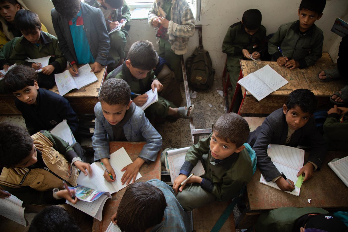 "I am proud of my mom, she is a great teacher who spreads knowledge to the students. I want to become like her - a teacher," Mohammed says.
Mohammed (10) is Rahma's son. He studies in the classroom, but dosen't always have a place to sit.
With support from ECHO, NRC has built new classrooms and wash facilities in the Yemen Al-Mustaqbel school in Sana’a.The new classrooms will accommodate an additional 500 students next school year.
NRC’s education programmes in Sana’a seeks to ensure that children affected by war have continued access to school. This includes displaced and host community children. NRC covers teacher incentives, repair buildings, train teachers and provide educational resources like desks and books.
Photo: Mohammed Awadh/NRC