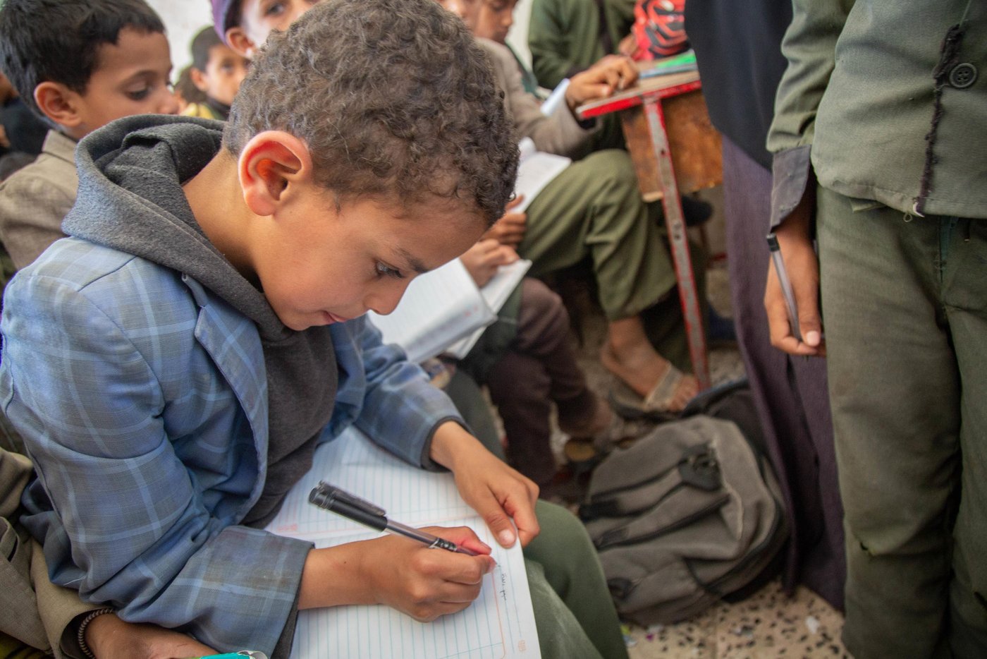 "I am proud of my mom, she is a great teacher who spreads knowledge to the students. I want to become like her - a teacher," Mohammed says. 

Mohammed (10) is Rahma's son. He studies in the classroom, but dosen't always have a place to sit. 

With support from ECHO, NRC has built new classrooms and wash facilities in the Yemen Al-Mustaqbel school in Sana’a.The new classrooms will accommodate an additional 500 students next school year.

NRC’s education programmes in Sana’a seeks to ensure that children affected by war have continued access to school. This includes displaced and host community children. NRC covers teacher incentives, repair buildings, train teachers and provide educational resources like desks and books.

Photo: Mohammed Awadh/NRC