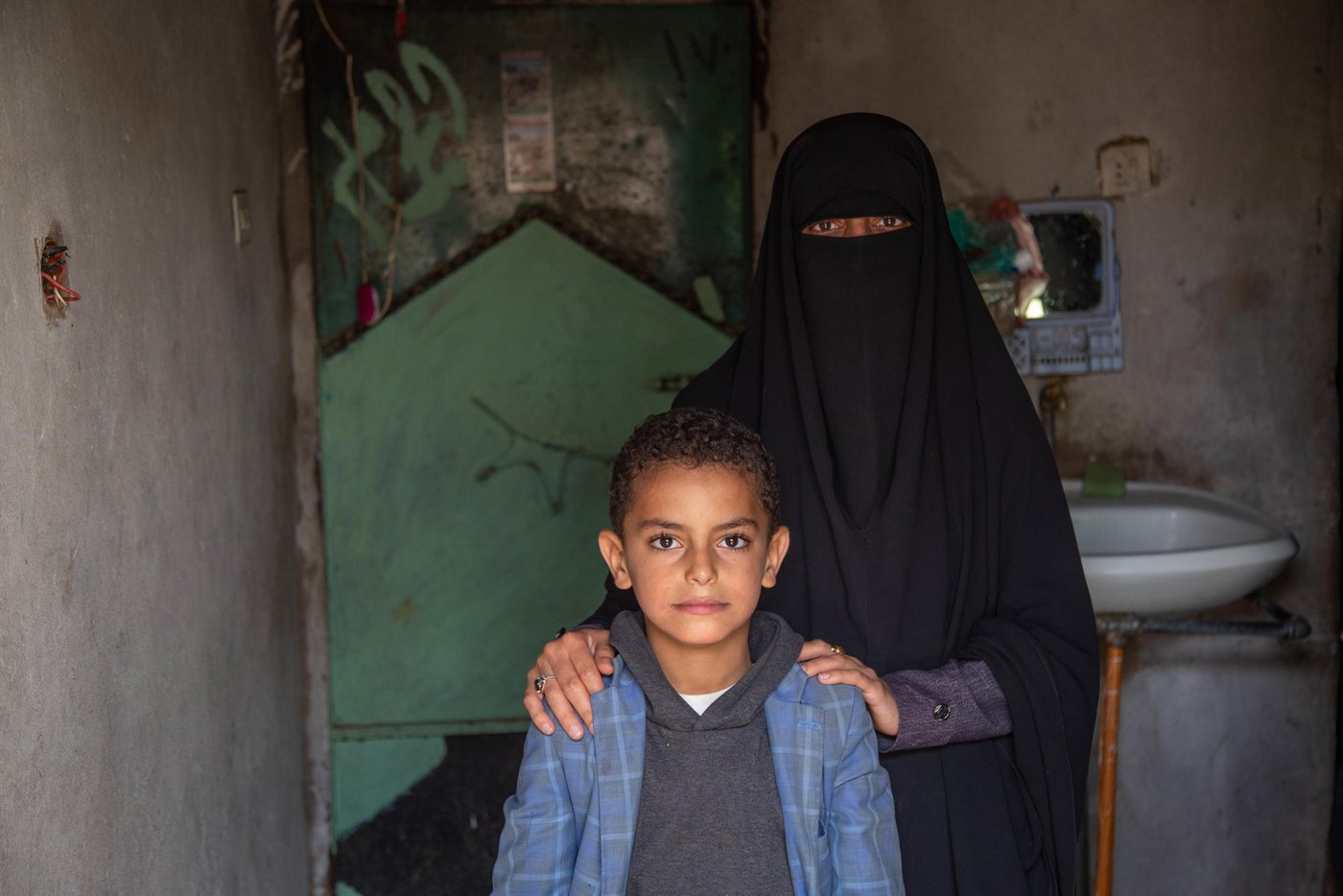 Rahma teaches Arabic lecture, she started her career in teaching since 2012 as a teacher. Her life was stable with her husband and her child Mohamed, 10 yrs. Before the conflict started, Rahma and her husband were able to afford the daily needs as the income could cover the house rent and food.
Since the conflict started, education sector in Yemen collapsed, Teachers who have not received regular salaries for two years, can no longer meet their most basic needs and have been forced to seek other ways of income to provide for their families. Rahma one of the teachers who haven’t received a salary and she could stay seeing her son starving after her husband also left them because he could not afford anything for them. Rahma has skills on drawing, an alternative way to get income she draws scholastic arts and sells them for schools in a nominal amount 400-500 Yemeni Rial which’s (1$) per piece.
“Before the war, we were receiving salaries, somehow it’s little but at least we can afford everything as prices were affordable. But now no salary and if we get the same amount of salary it will not cover 50kg of wheat… it's nothing.”
“Sometimes, I borrow money to get my son a sandwich for breakfast and some stationary for my son, I want to keep him motivated after his father left us. I don’t want to destroy his future.”
“I use my skills on drawing to draw scholastic arts for the schools, I get around 1$ per piece, it not much, but I love doing it”
Despite all the challenging she faced, Rahma continues going to school and teaching the students. Her motivation is to educate the next generation who’d build her country and she believes that it not fair to let those children without education.
“The motivation to come to school is to educate and build the next generation, and it’s not fair to let Yemeni children without education no because of the salary, the salary is nothing. I want also to keep my son motivated to not leave the school.”
Rahma sees the students suffer the most, the student behaviors changed because of the war and the students become more violent and aggressive, in addition to that some of her students cannot afford the transportation or breakfast, they sometimes come to school hungry which make them unable to comprehend the classes and some cases fall down during the day because of hunger.
“I remember one of my students has fallen down because she did not eat breakfast and she cannot afford”
“I can see also some student cannot be active in the class because they eat only one meal per day according to my discussion with some students.”
“Students also traumatized because of the war and they can no find a safe place to study.”
Rahma’s son Mohammed 10, years old, 5th grade, He is the only child for her. Raham takes Mohammed every day with her to the school to save more money even if she has no classes to teach, they go together to the school to by walking. The school is one kilometer far away from the school it exhausting for her son.
“I take my son every day with me to the school, in order to save some money, we share the breakfast together even if I don’t have classes I stay until he finishes.”
School situation
The school is a poor condition, small and it hosts more than 1500 students. The school building is basically a rental house and it has no school facilitations or yard for students. In addition to small classrooms with almost no desks. Some students take their classes on the roof of the school building due to a shortage of space.
“The building is a poor condition; the classes are small and student set on the ground. The affect negatively on students. Some of them the study on the roof under the sun.”
“The fear also from the diseases, the crowded place could be a place for spreading the disease.”
Rahma’s dream is to become an artist, she wants to sell her artworks to help vulnerable people in Yemen and help them to get medical treatment. Also, she wants the war to end
“I want to become an artist so that I can sell my arts and give the money to people in need especially who need medical treatment that causes by this war.”
“I wish the peace returns back to my country. I don’t want to see children’s future unknown.”
NRC is responding to Yemen Al-Mustaqbal School with ECHO fund by building new classrooms and desks, in addition, to conduct training for the teachers and creating temporary Learning Spaces (TLS). The students will be able to move the new building in the coming school year.
“Thanks for the donor, we are really excited to move the new place, I am sure that the new build will be a motivation for the children and change to their behaviors.”
“Students will have a place to learn and play, the new building has a lot of facilities that would help students to have a quality education.”
Photo Credit: Mohammed Awadh/NRC