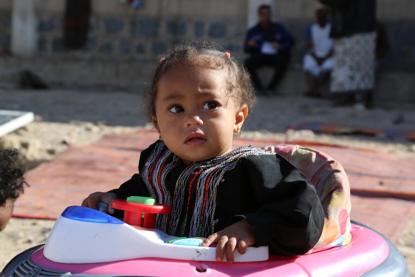 Lailah Rabei Al-Raboui, one-year-old, playing in the yard of Al-Fajr Al-Jadeed School where her family has been living since 2015 after the war forced them to flee their houses in Taiz city.

Photo: Nasser Abdulkareem/NRC