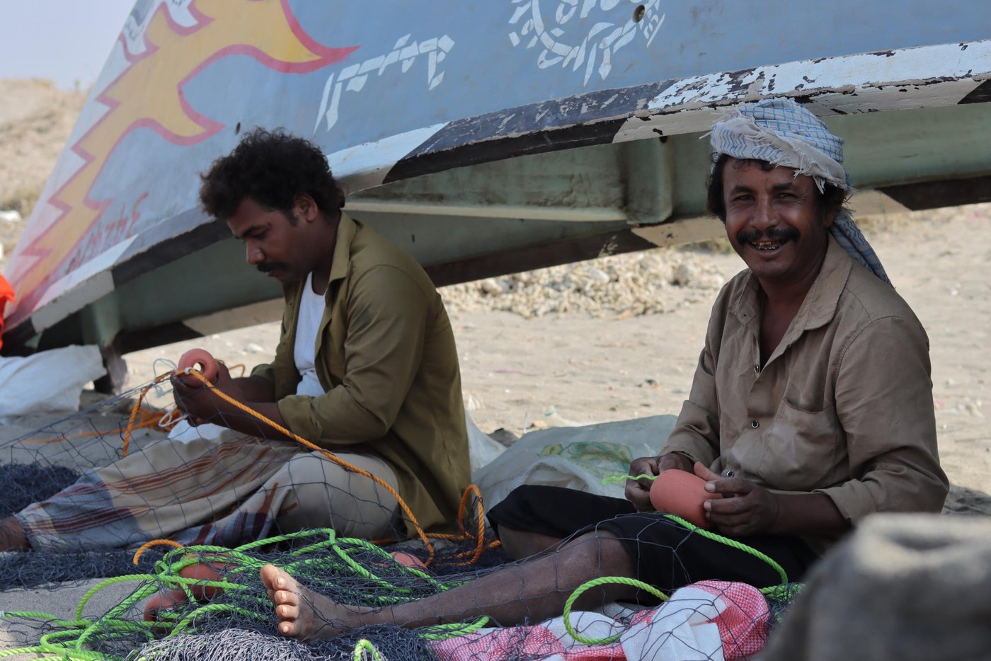 Fishermen maintaining their fishing nets

To help the coastal communities in At-Tuhayta stay on the water, the Norwegian Refugee Council [NRC] and the Yemen Humanitarian Fund provided fishermen in his area with a package of useful support. Everyone received life jackets and other equipment, and training on best fishing practices and how to navigate and stay safe at sea. They also received a small cash payment to help them through the tough times.

Photo: Mahmoud Al-Filastini