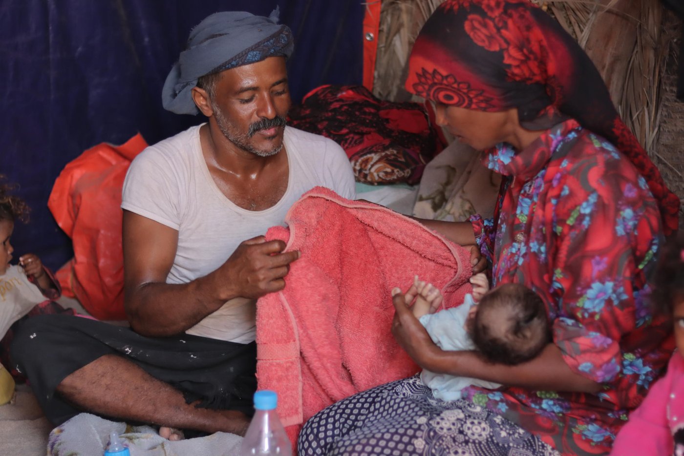 Zaid and his wife and daughter

Zaid is an experienced fisherman; he was taught by his father how to fish when he was a little boy. But when the fighting hit Zaid's village in Hodeida two years ago, he took his seven children and his wife and fled to At-Tuhayta district. At-Tuhayta is not far from the frontlines, but it is safer than their home village.

Since Zaid fled his home, he has been working in At-Tuhaytah with some of his new neighbours to provide for his family. Zaid says he faces challenges in maintaining his fishing gear and boat, along with increased costs because of a fuel crisis caused by the war. “Sometimes everything we catch goes on fuel,” Zaid says. “To save on fuel we use paddles, but then we can’t go far out, to where the big fish are.”

Zaid’s wife also suffers from a mental disorder, leaving him torn between taking care of his family and making ends meet. “With my wife’s condition I stay at home to take care of the children. I give my wife her medicine, cook for the children and feed my baby girl,” Zaid explains. This makes it difficult for him to go on long journeys and to be able to catch enough fish.

To help fathers like Zaid stay on the water, the Norwegian Refugee Council [NRC] and the Yemen Humanitarian Fund provided fishermen in his area with a package of useful support. Everyone received life jackets and other equipment, and training on best fishing practices and how to navigate and stay safe at sea. They also received a small cash payment to help them through the tough times.

“NRC provided us with fishing nets and an icebox,” Zaid explains. “Before, we used sacks to store the fish we caught. We put some ice in plastic bags and put them with the fish. Now with icebox from NRC we can store the fish for much longer and go on longer fishing trips, without worrying the fish might go bad.”

“Thanks NRC for the support they gave us and thanks for the people who funded them,” Zaid adds.

Photo: Mahmoud Al-Filastini