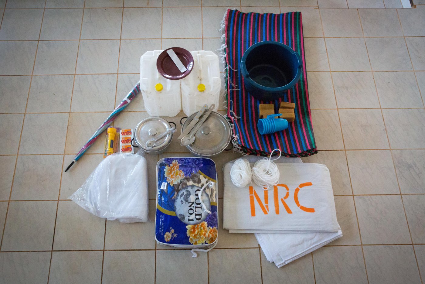The standard NFI kit that is distributed to internally displaced and vulnerable host community members in the North West province.
Photo: Ingebjørg Kårstad/NRC