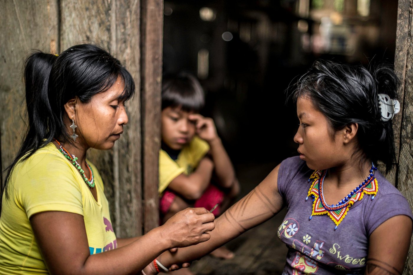 The Embera people decorate their bodies with beautiful patterns using body paint. The paint is made from the juice of a fruit called "jaqua" mixed with soot to make it black. If you let is set for longer, the fruit juice will have a darker colour. 

In October 2017, Melida Isabaré Papelito, 36,  fled with her husband and children from their home to the village of Catrú in Colombia’s Chocó region. The thirty-six-year-old woman is part of the indigenous group Embera and in October 2017, one of their community leaders was killed by an armed group.

"I hope we can get help to survive," says Melida.

Her people have lived in this area for generations. Over the years, they have been displaced several times. 

In October 2017, more than 1,0000 people fled to the village of Catrú in Colombia's Chocó region. 

"They came because they feared that more people would be killed," says one of the community leaders in Catrú, home to the indigenous Embera people. 

The Pacific region, particularly Chocó, has become a battleground for clashes between the National Liberation Army (ELN) and another armed group. Indigenous and Afro-Colombian communities have been disproportionally affected. Seven out of ten people displaced this year come from these communities. 

In many areas previously controlled by FARC, armed conflict is still ongoing. In some areas, the fighting has increased since FARC laid down their weapons, as armed groups are attempting to take control over strategic areas, natural resources and important drug routes. In many places, paramilitary groups have moved in, causing increased fear among the population. Violence has increased throughout the country, as has the number of local leaders being murdered.

The Norwegian Refugee Council (NRC) has been present in Colombia since 1991. In Chocó, we inform indigenous groups about their rights and provide legal aid in questions relating to land rights and compensation after having been forced to flee. In Catrú we help make sure that children get to go to school, and provide clean water to the community.


Photo: Ana Karina Delgado Diaz/NRC