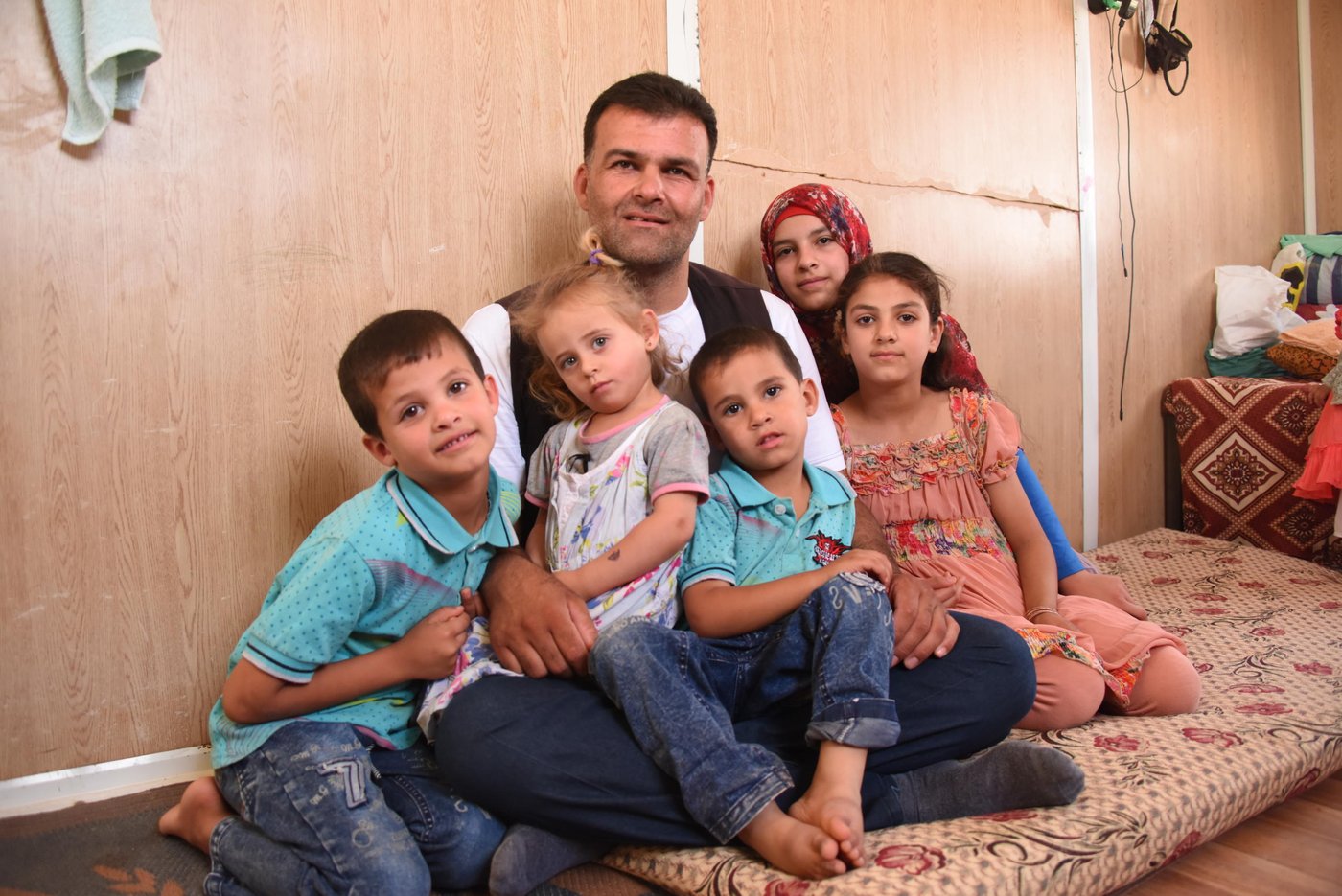 Anwar Alayan is a Syrian refugee from Dara’a—the place where it all started as a peaceful protest and turned into a brutal conflict. He has been living in Zaatari since it was opened.
“Back then, the camp was chaotic,” he says. “People were living in tents and there were no bathrooms, only latrines. There was no privacy. Now the camp is completely different. There are many more facilities and services. There are no more tents, everyone is living in prefabs. We feel more at home now.”
He left everything behind to take his family to safety. He is now one of NRC’s trainers at the youth centre in the camp, teaching carpentry, blacksmithing and painting. Those are skills he brought with him to Zaatari—no war or catastrophe will ever take them away from him— and he is now imparting them to others like him.
Photo: Elias Abu Ata/NRC