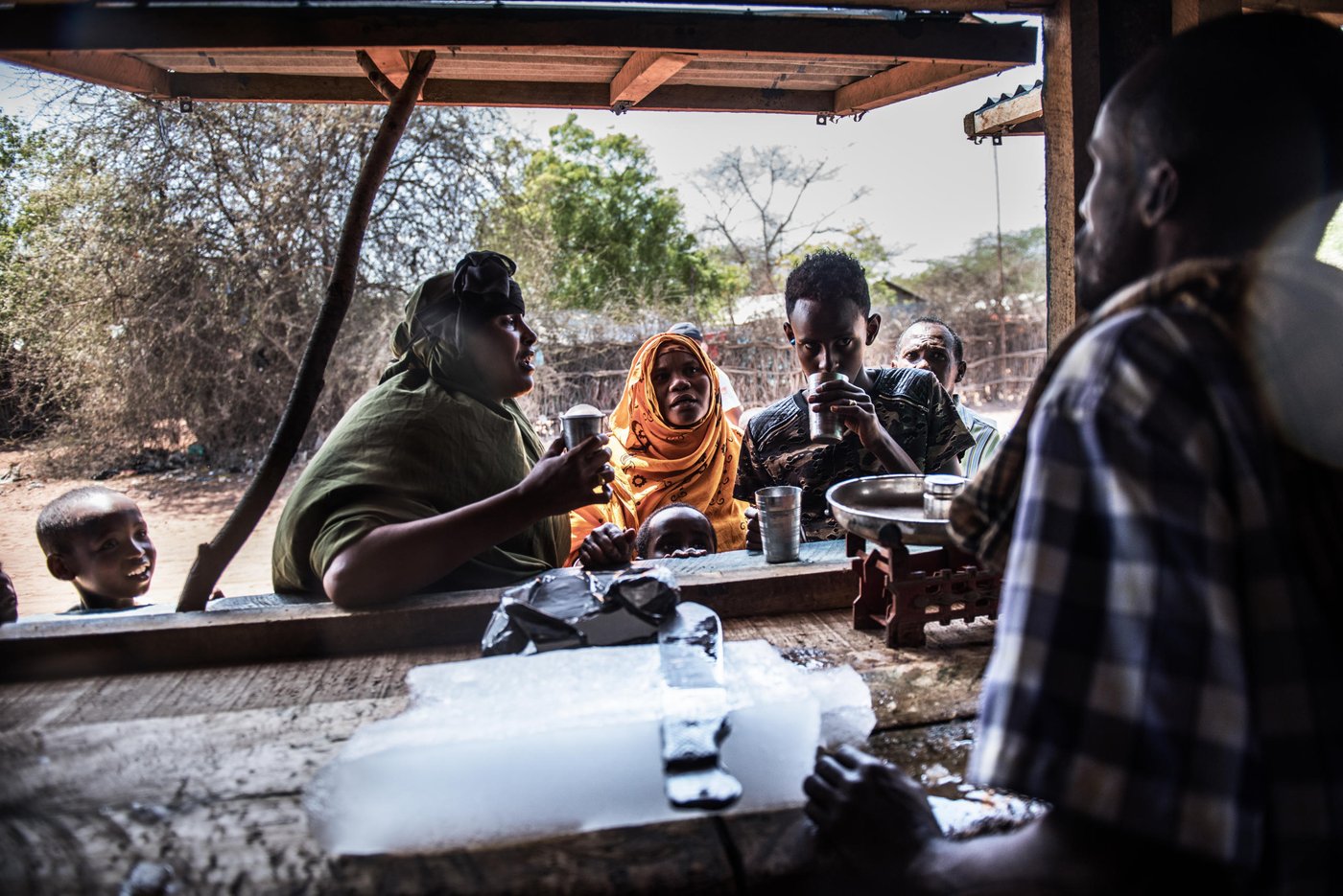 Ice is sold to refugees in front of the Hormud Youth Ice Plant.
Workers at the NRC-supported factory create ice and sell it in blocks to refugees in the camp. They also sell flavoured ice cold soft drinks.
The Hormud Youth Ice Plant has been providing jobs for young Somali refugees for 9 years. It was set up as part of NRC’s youth education programme. It is a one-year informal education plan designed to support young people affected by conflict, who have a lack of opportunities or missed out on school. Through the programme, youths acquire a marketable skill to increase their chances for finding employment. It includes crafts such as tailoring, journalism, hairdressing and welding.
Date: September 2016
Photo credit: NRC/ Fredrik Lerneryd