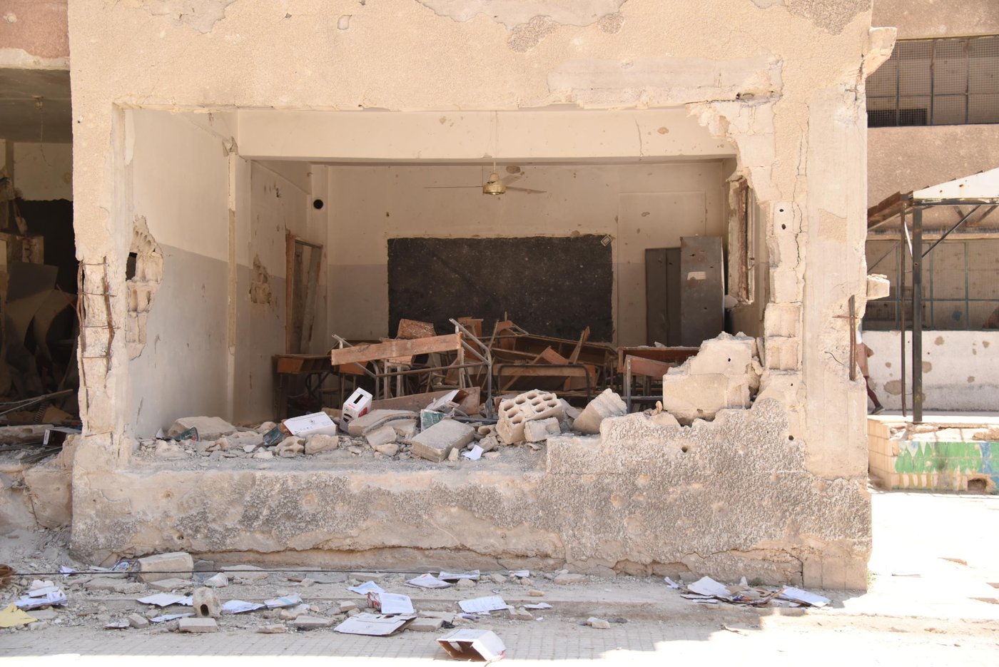 This school in Harasta, Eastern Ghouta, has been half destroyed, with other parts heavily damaged. NRC’s shelter team estimates that at least US$500,000 are needed to repair and rebuild the school. Nevertheless, students and teachers are making use of the few remaining classrooms to catch up on years of lost education. There are currently 725 children attending this school.
Photo: Karl Schembri/NRC