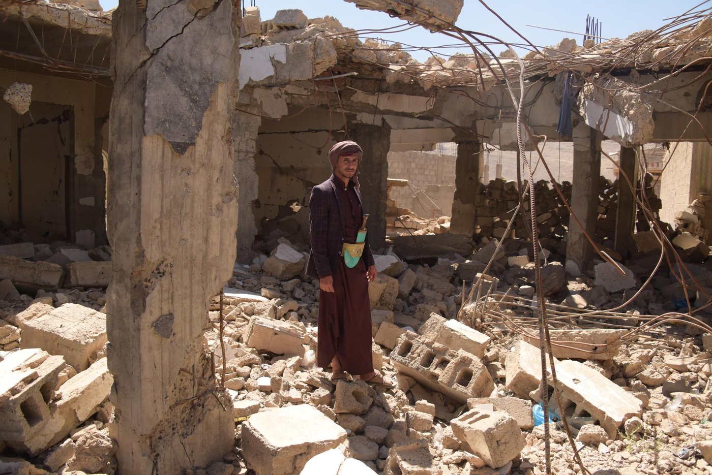 Mohammed Abdullah Al Tamerah lost two of his daughters, his mother, his brother and two sisters in an air strike on his house in Amran on 7 September 2016.
We were living in this house with neighbours... Abdullah Al Tamerah family... Abdullah al Zubairy and Abdul Wahab El Emad
The incident happened at 11:30pm Many of them were martyred and a few of them survived.
From my family, six members were killed ... martyred ... My mother, brother, two daughters and my two sisters.
My neighbour, his entire family were killed, , both he and his wife, and his son. The other neighbours survived.
My father was the only one who survived from my family... Me, my wife and my daughter were in Sana’a... we traveled two days before the attack.
My mum was about 45 years old – 48 years old ... my sister 12 years old ... my daughter 4 years , and the other 3 years old, my brother 7 years old and the other girl 8 years old.
I did not expect this. This is horrible, but the aggression is ruthless... it kills... as you can see that most of those who were killed are children and women.
We don’t know the reason ... it’s an aggression... we were attacked with three air strikes at 11pm.
The first time I got the call I was shocked! It’s a total tragedy that I couldn’t cope with. I fell unconscious and so did my wife.
My father was thrown out of the house by the blast and he was seriously injured.
He was burnt all over his body, even his clothes were burnt on him.
They took him to hospital; the dead bodies were recovered. The last body was recovered at noon the next day. They were searching for it under the rubble, the house collapsed on them. The others were taken to Amran hospital.
They died immediately. Some bodies were recovered at night and some bodies by noon the next day.
(When I left for Sana’a) we cried… I was out the door and my daughter shouted from the window, “Dad are you going to leave us? Are you going to leave us?” I told her I was only going to take our little daughter to hospital and I’d be back. She kept calling me to come back. I did not come back on the same day.
I am 28 years old. I have a bachelor’s degree, I worked for the Social Development Fund in the empowerment programme and I also worked on the cholera campaign. But now I don’t have a job ... I am jobless.
I applied for programss and with organisations but I haven’t been given a chance yet.
I have faith things will go the way they’re meant to go.
I want to send a message so they stop hurting us and we can start our life over again.
I cannot express my feelings ... two, three or ten hours will not be enough … the situation is unimaginable … You go to sleep having a family, and you wake up without a family.
You wake up and see your house in rubbles all around you ... you see your family and your kids reduced to pieces of flesh.
Thank God we got through the worst of it… it was hard.
The only way out is a political solution in Yemen.
My message to the world is to intervene urgently to end this war on Yemen , we need a political solution and reconciliation between the Yemeni people
and provide aid to Yemeni people, provide aid to them.
I used to receive a salary of 60,000 or 70,000 Yemeni Riyals, we were able to buy food for a whole month.
Now it’s different. We can only afford the essentials, like house rent and such things.
We got some help from an aid organisation to pay for our rent.
And we got a food basket from the authorities, and as you can see we have only the essential things inside the house
Once the attack targeted the house we took the bodies to the hospital and we left Amran for a couple of months.
We then thought of returning to reunite with the rest of our family and start over again.
We rented a house in Bait al Faqeeh … as you can see we could not recover anything from our destroyed house.
Everything we have came from the Red Crescent and some aid organisations, like mattresses and kitchenware.
We started our life all over again, step by step.
The situation in Yemen is getting worse, as you can see. Destruction, devastation and killing every day.
If the aid stopped, Yemen will end up with a famine. So my message to the world is to find a political solution.
Photo: Karl Schembri/NRC
Photo taken on 30 January 2019