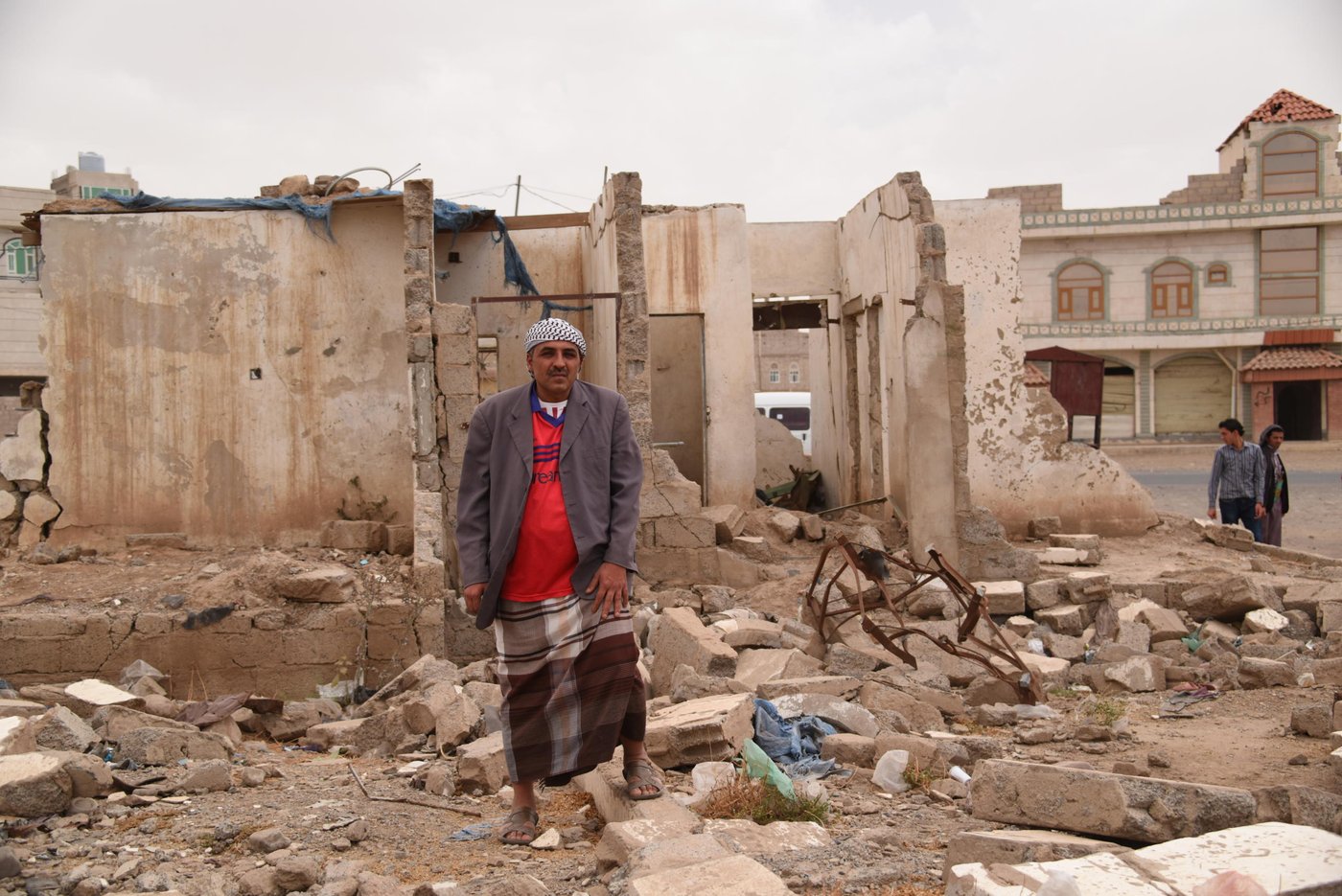 Yasser al Hibshi, 38, lost his house and three of his children in one of the first air raids launched by the Saudi-led coalition on the night of 26 March, 2015. He revisits his neighbourhood and speaks on the site of the ruins of his house about that fateful night.
"An air strike hit us on 26 March, 2015, in the first strikes on Yemen. It was between 2am and 2.25am, I was asleep and can’t tell you the exact time.
"Three of my children were killed: my daughter Aisha, 11, and my sons Ammar, 17, and Alaa al Deen, 14.
"I was taken by an ambulance to hospital where I stayed for more than 15 days. I was injured in my head and have two parts of my spine broken. I was in a coma and had no idea what had happened, no idea that my children had died.
"My relatives used to visit me in hospital and I thought my children were in the intensive care unit, not in the morgue. I thought they were OK. I didn’t know until I had surgery in my spine. I got out of surgery and after some five days they started giving me the news gradually. They were gradually telling me this neighbor has passed away, the other neighbour has passed away… I then asked them directly: where are my children? Then they told me that my children had passed away. Three of them. There were some 27 others from Al Muallem’s family, Al Hadrami and Al Jermuzee… all of them were my neighbours. Until this day I expect them to show up.
"I took me more than five years to save money and build this house. We lived in it for around 15 years. I had a stable life… my children, my house, my car, my shop … It’s all gone now. I used to have a grocery shop, a car, and I was coping… my kids were studying…. Today we have to pay rental fees and suffering without any source of livelihood. I have no source of income now except for the help I get from good people. Some NGOs reached out to us but now we’re not getting anything. I still have spinal injuries… If I fully recovered I would look for work, but it’s taking long. I feel a lot of pain if I had to pick up something heavy.
"We won’t die of hunger because some relatives and friends are helping us. I’ve sold my car and my shop so I can cover my children’s needs.
"Yes my children still go to school. One, Najm al Deen, is in the ninth grade. The other is living with his grandpa because he’s still traumatized. He’s staying at my father’s house to live away from the tragedy and overcome the trauma of what happened to us. He was not in the house during the air strike so we try to make him forget what happened to his siblings, because the neighbourhood would always remind him of this tragedy. We were thinking of sending my other son with him but he has not yet fully recovered… he still has shrapnel in his body. Now he’s getting treatment and continues going to school.
"I want to tell the world that we’ve had enough of the war. There is too much tragedy, so many families have been wiped out, for what? We hope that God will deliver Yemen and the Yemenis out of this situation.
We hope to get out of this crisis."
Photo: Karl Schembri/NRC