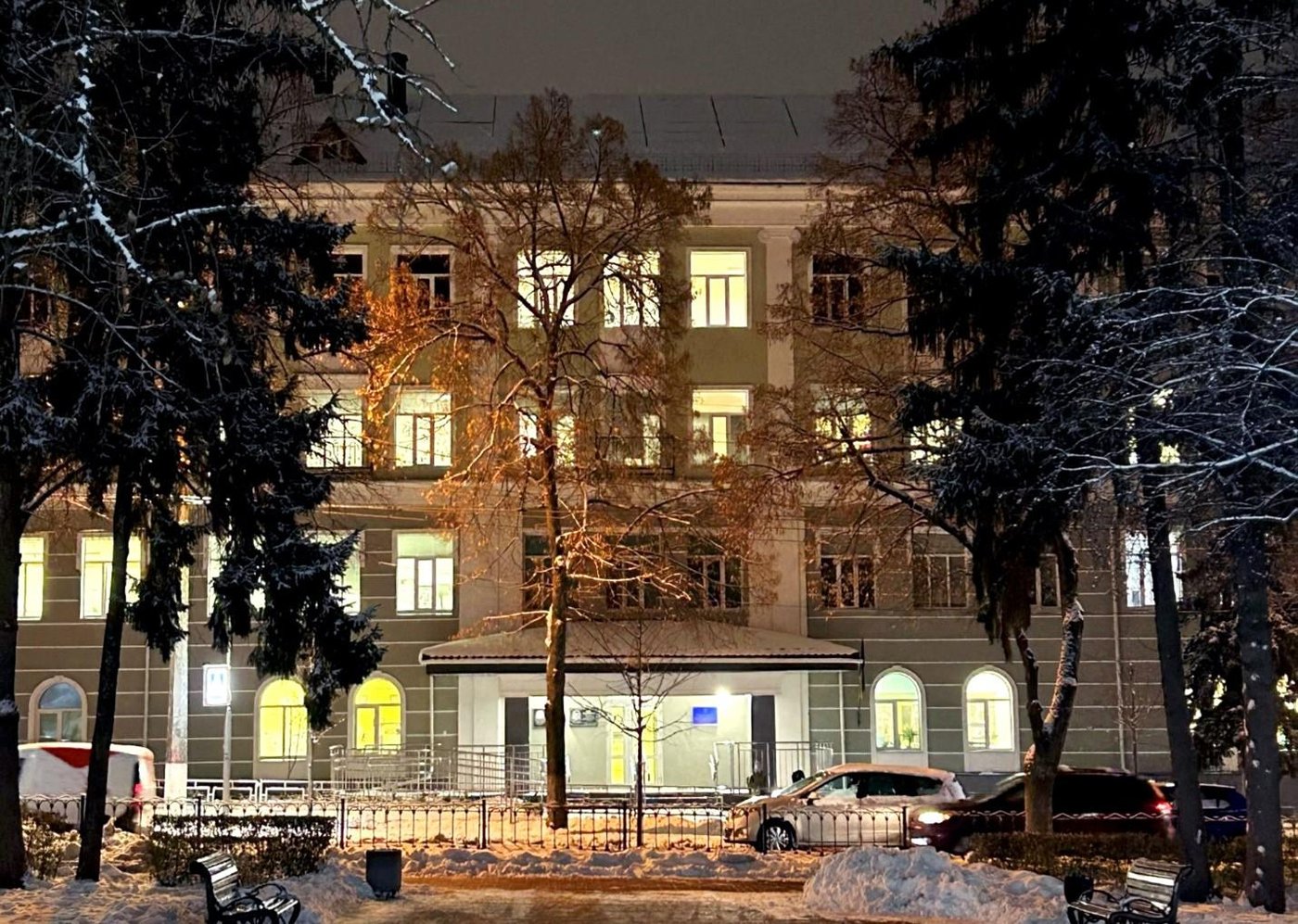 The school in Chernihiv, rehabilitated by NRC in partnership with other organisations, is pictured surrounded by snowy trees and a snowy landscape.