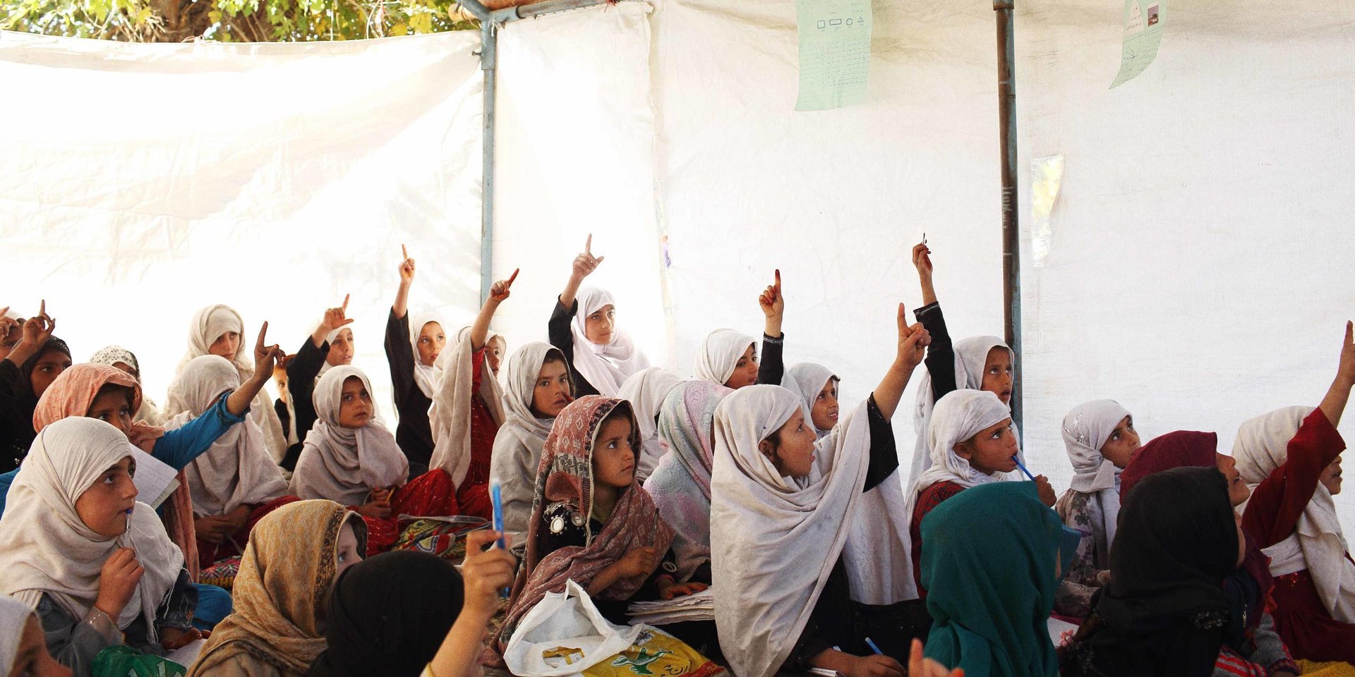 A scene from a community based school run by the Norwegian Refugee Council (NRC) in the Behsud District of Nangarhar province, just outside the provincial capital, Jalalabad. The school caters for internally displaced children, most of whom have returned from Pakistan after years as refugees. The majority are from families originally from Kunar province but due to ongoing conflict there are unable to return. (Photo: Andrew Quilty / Oculi for Norwegian Refugee Council)