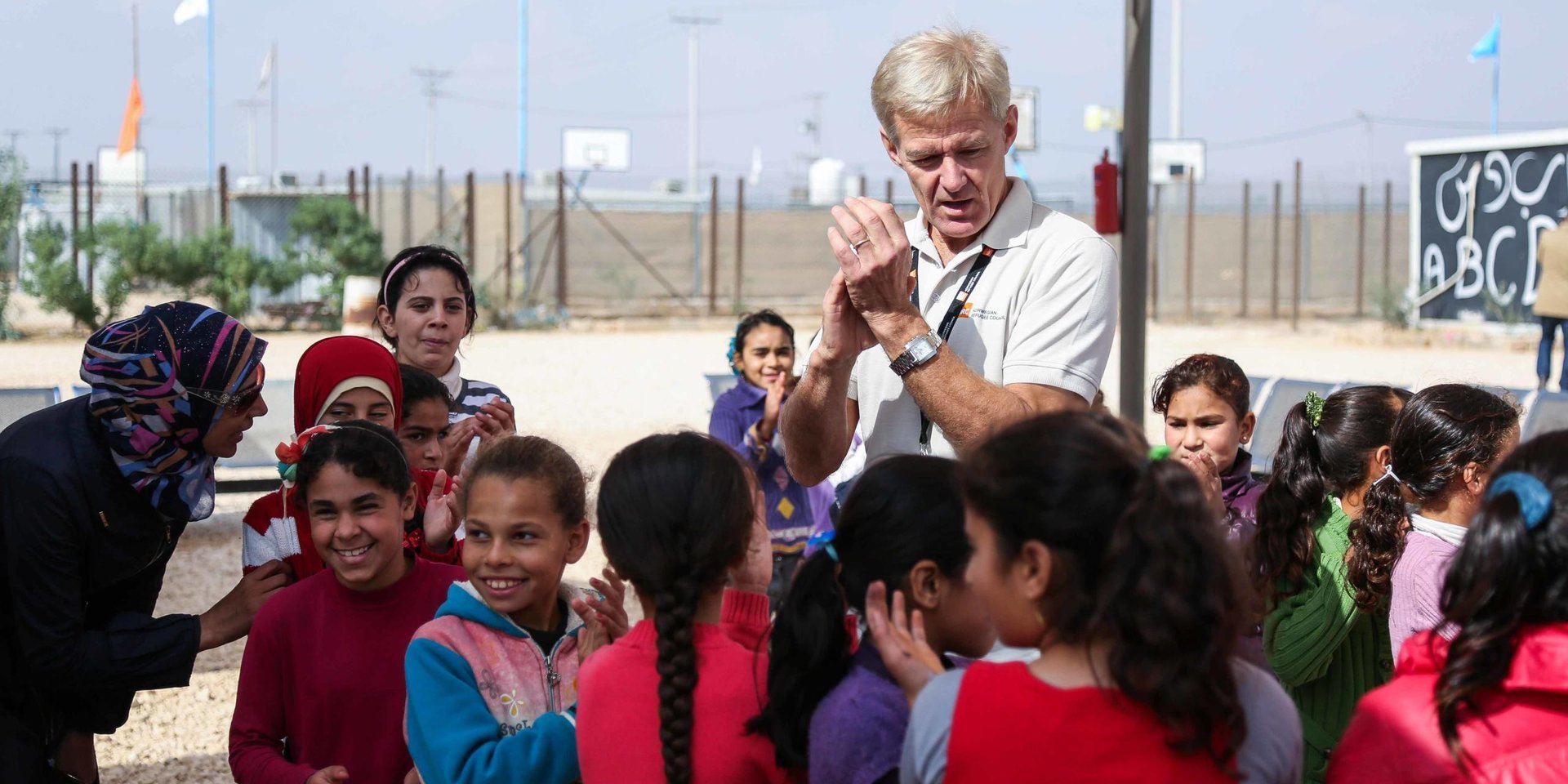 Jan Egeland during his last visit to Jordan, singing with the children their daily song at NRC Education Centre in Zaatari Refugee Camp.
9th November, 2015.
Photo: NRC/Hussein Amri
* These captions were written by a person whose English is a second language.