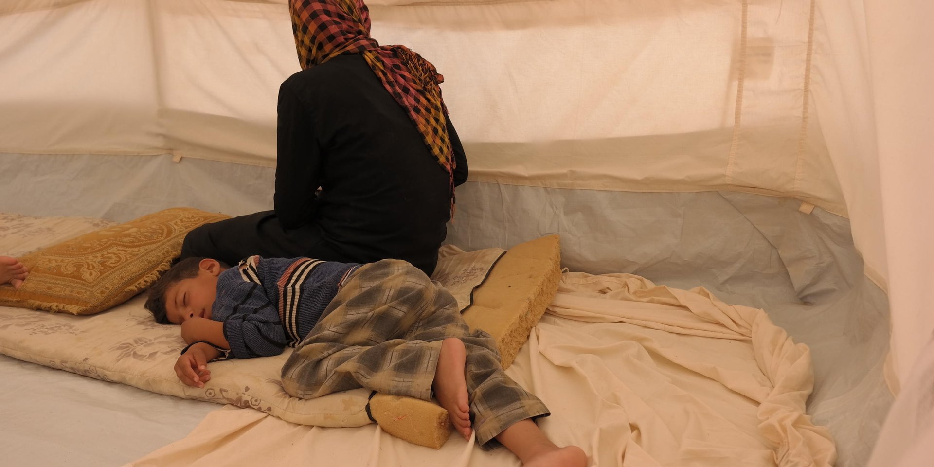 Ishwaq, her husband and their three children (all under the age of 12) managed to escape Fallujah on Monday 23 May 2016. They only managed to bring with them two towels, one bag with their ID's and the clothes on their bodies. They ran during the night for three hours before arriving at the border checkpoint where they raised white flags made by cloths so they wouldn't be shot at.
NRC is present in Al Iraq camp in Amiriyat Al- Fallujah, Anbar providing newly displaced families from Anbar and Fallujah with water, food parcels and hygiene kits.
Photo: NRC/Becky Bakr Abdulla
