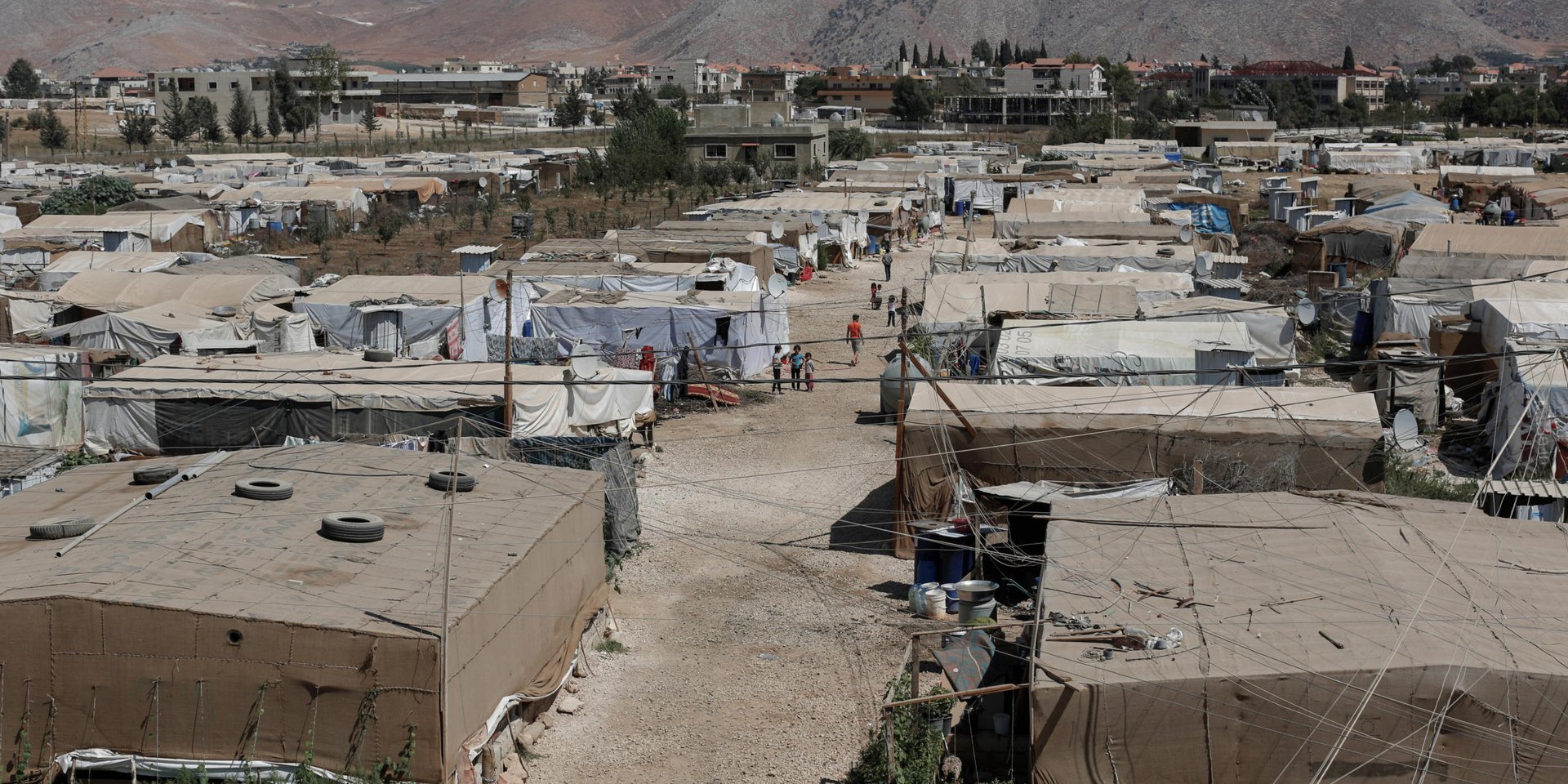 A view of a refugee settlement of the Ghazzeh informal tented settlement in Lebanon's Bekaa Valley.
The Ghazzeh ITS is one of nine currently benefiting from a pilot Community Capacity Building (CCB) project run by the Norwegian Refugee Council.
The committee, supported by NRC, has been provided with mobile phones and other materials to facilitate coordinating with service providers directly, to monitor and report the situation in their ITS, and to monitor the levels of assistance provided to them to decrease reliance on external agencies and give the refugees more control over their own situation.
CCB committees comprise around ten members, with five pairs responsible for men, women, the elderly, youths, and people with specific needs. NRC is currently working with CCBs at nine informal tented settlements and plans to expand the project to seven more in the near future.
NRC/Sam Tarling