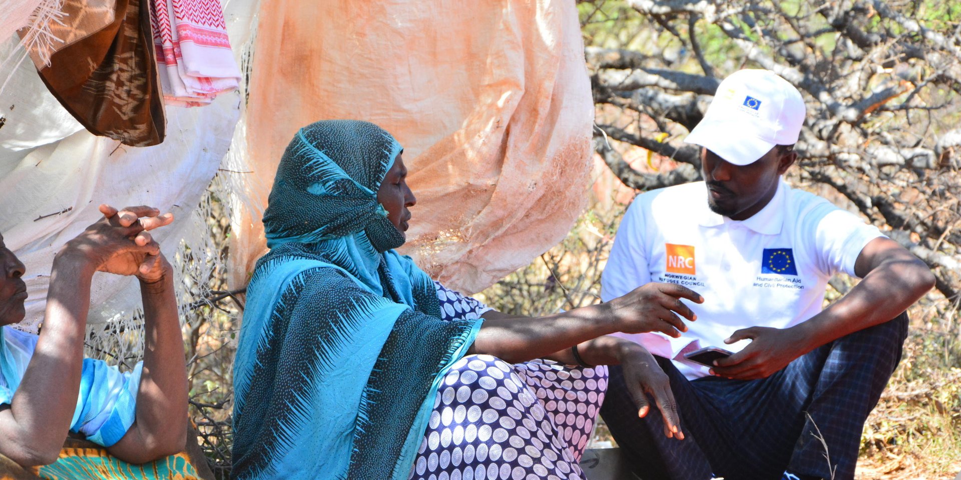 Faadumo, an old lady that has moved from Dhumey village after clan war erupted is being interviewed by NRC staff.
Fadumo now lives in Timoolay camp