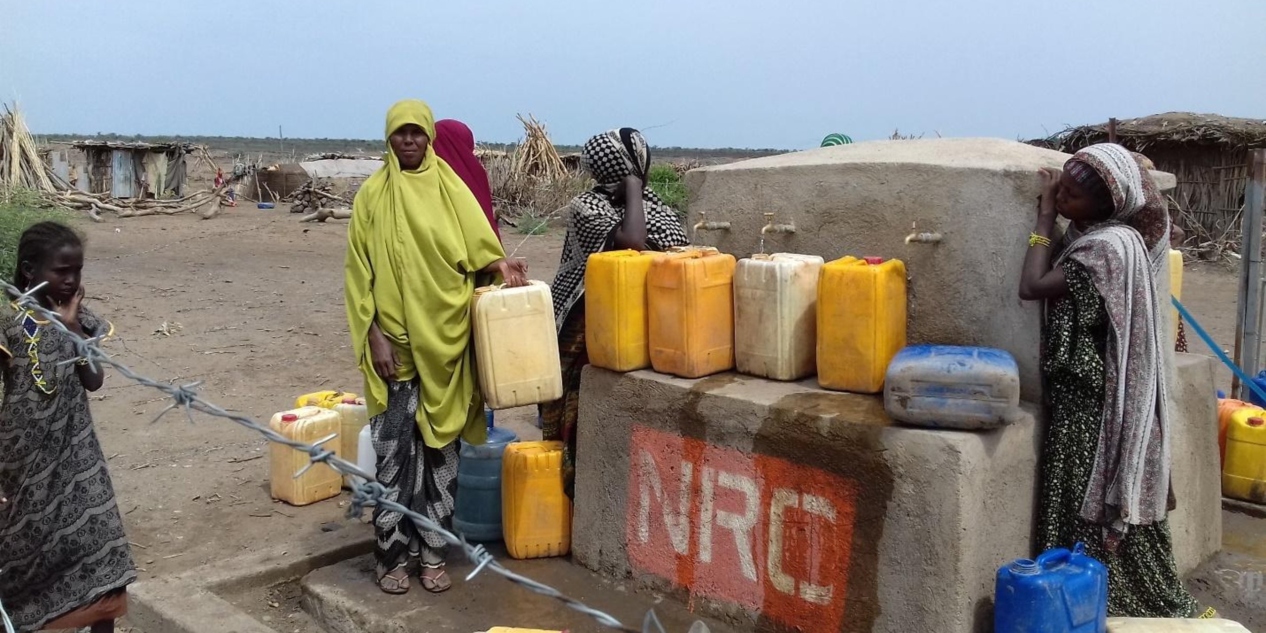 Every morning and evening, the village community collects clean water from tap stands constructed by NRC.
The humanitarian crisis has worsened in drought-stricken Ethiopia, with almost three million additional people in need of humanitarian aid this year.
8.5 million people are in dire need in Ethiopia due to worsening drought and a deteriorating food security situation, up from 5.6 million in January, according to the United Nations. Despite this, the international aid appeal for the country is only one quarter funded, nine months into the year.
“Civilians living in rural areas in the south and east of the country are the worst affected,” said Gabriella Waaijman, Regional Director of the Norwegian Refugee Council. “The nation is facing its worst drought in decades. 8.5 million men, women and children need immediate food assistance. We are calling on donors to urgently scale up the funding needed to meet the massive needs we are witnessing.”
The periodic heating event El Niño is in its third successive year of wreaking havoc on lives and livelihoods in Ethiopia. This has left the country among the most drought-affected countries of Africa.
Photo: NRC/Meftehe Mekonnen