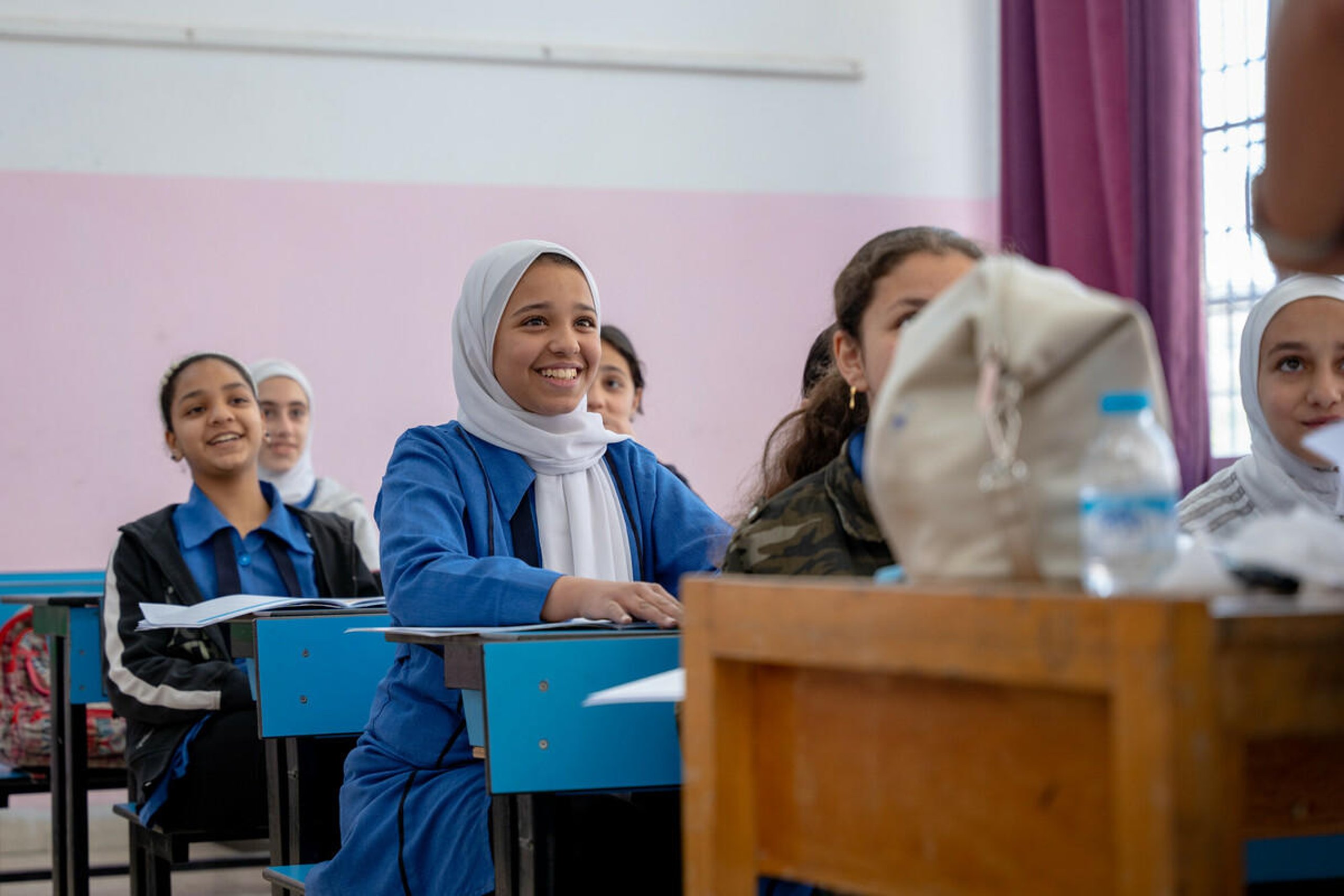 Pupils sitting at desks in a classroom.