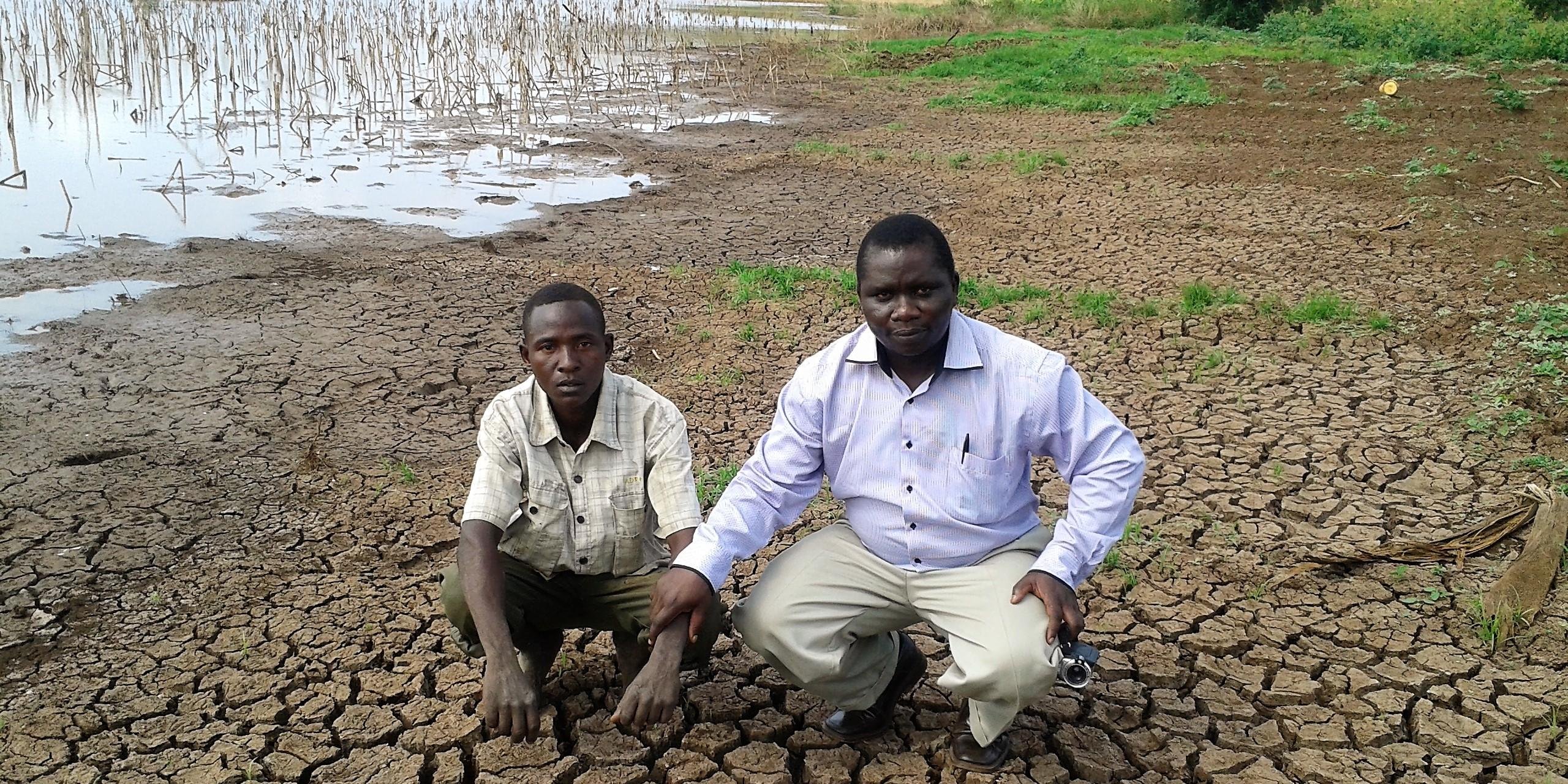 NORCAP Climate Information Services Expert, Philip Omondi (right) with a local representative showing impacts of prolonged drought in Tana River County. The drought was exacerbated by 2016/2017 La Niña phenomenon (Photo: Philip Omondi/ICPAC/NORCAP)