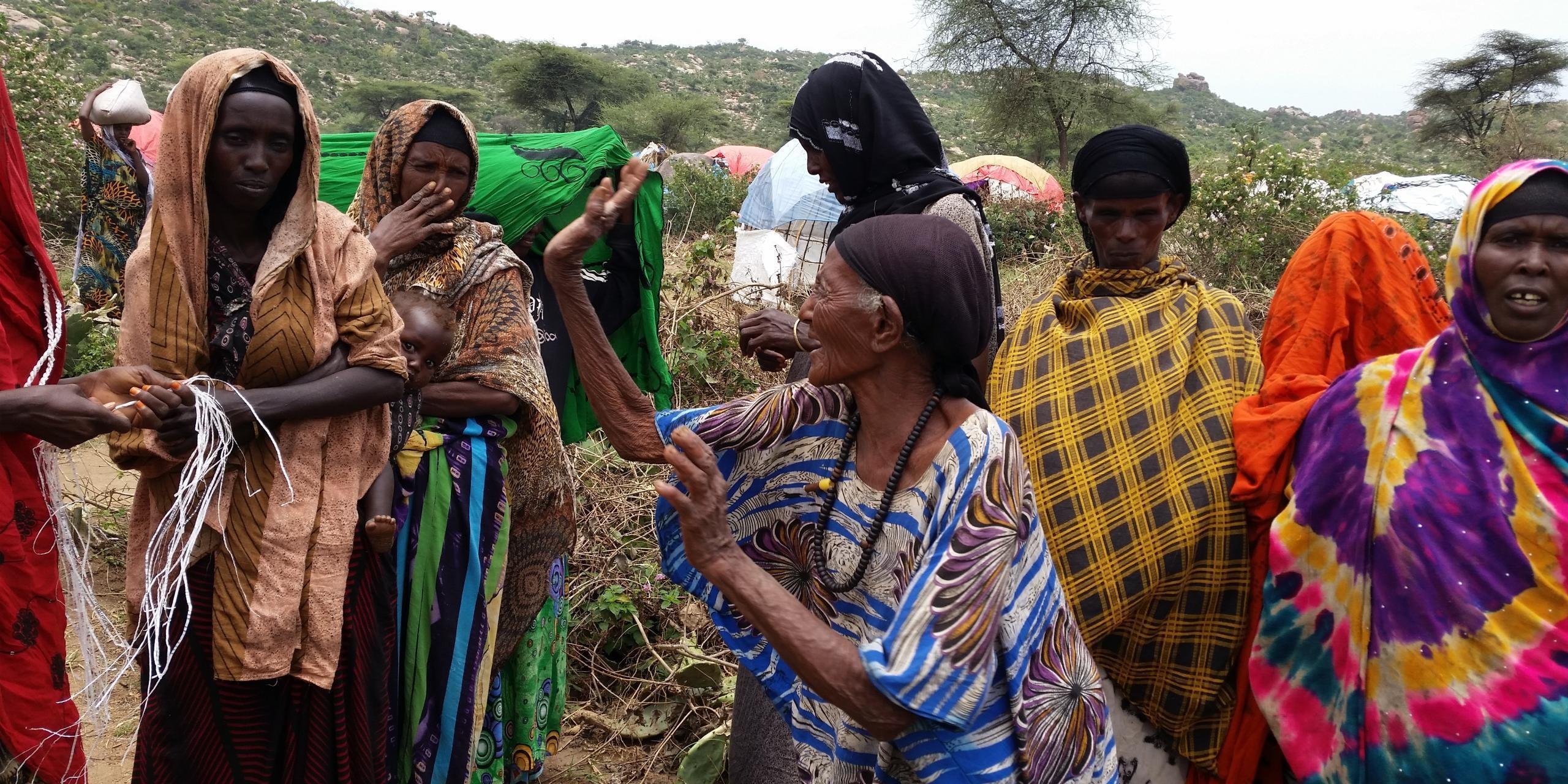 “Now I have to learn how to live in a small traditional hut, at the age of 84”, says Ibado Samatar, a farmer in Ethiopia.
Ibado had never left her home town of Mechare in west Oromia. But when her family was attacked by marauding bandits, and her farm was razed to the ground, she had no choice but to leave. Now resettling, she will live in a small ‘buul’, a traditional hut in Somali language. She is part of 6,000 households displaced from the Oromia region into the Somali region due to the conflict and the current drought.
There are now more than 6,000 internally displaced people that have arrived in Anot Keble in Ethiopia’s Somali region. Recently there have been few new arrivals, but many more families have been sheltering here for over a year. After losing their homes, their social support systems, and having lost their livelihoods, Ibado and other displaced families here have extensive needs for survival. Anot Keble has become a central location for households displaced and on the move. Most displaced families are trying their best to construct temporary shelters for their families under the scorching sun by using whatever materials they can find.
They all are survivors, and hopeful that life will get better.
Coming together with partners, including with government authorities from the Oromia and Somali regions, the UK Department for International Development (DfID) and UN Office for Coordination of Humanitarian Affairs (OCHA), NRC has taken a lead in reaching the hard-to-reach populations with emergency shelter and the provision of household utensils.
While it remains clear that humanitarian needs here in Anot Keble are critical, the NRC team on the ground in Ethiopia will continue its urgent work, at times traveling for long hours to reach those in need, near and far, with much needed emergency assistance.
Photo: NRC/Mefti Mekonnen