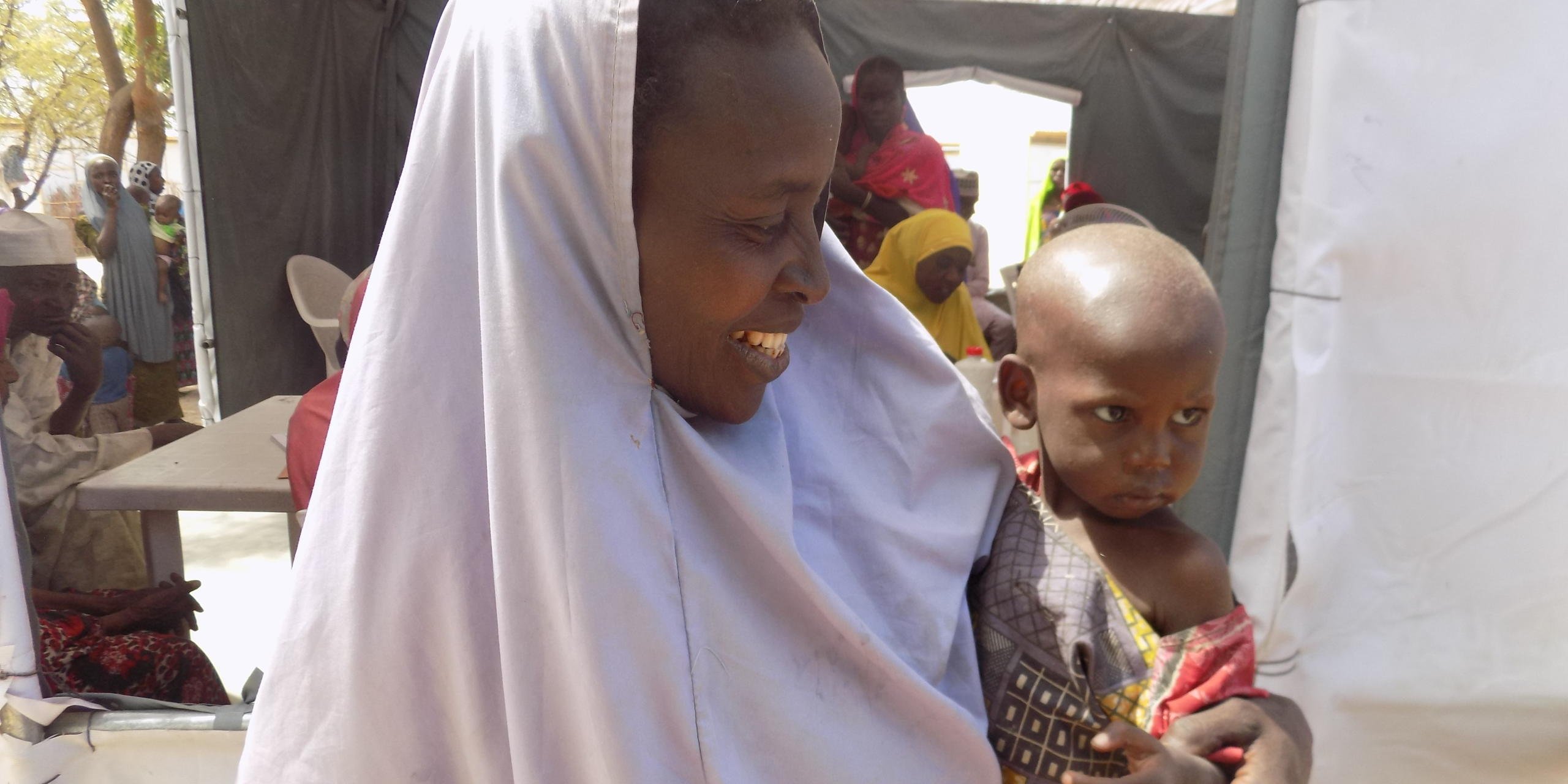Kaltima's 2 year old son suffers from severe acute malnutrition, as determined by NRC hygiene promoters in Shuwari, Maiduguri (NRC Nigeria/Rosalyn Velds)
