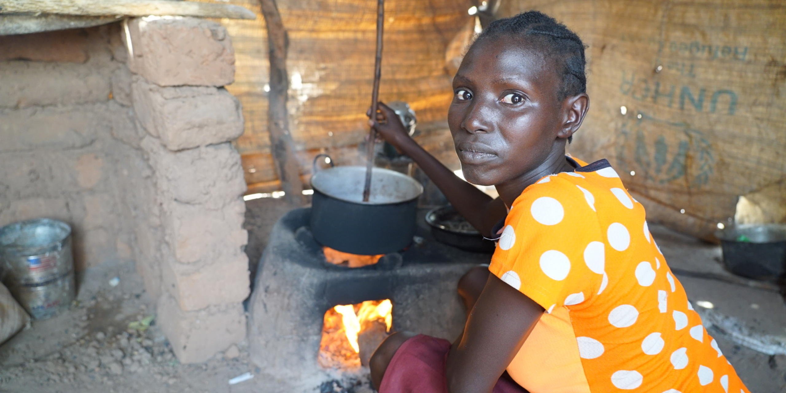 "The beans need to cook for several hours before they are ready. The room gets very hot while I am cooking, so I use to step outside while it boils. The fuel efficient mud stove needs less firewood than the tree-stone fire I used before. Now, I only collect firewood 2 times a week in stead of 4. The road that I have to walk to collect firewood is not safe for me and my friends, so I am happy that I don't have to walk that often anymore."
NORCAP is addressing the energy needs in the refugee camps in Jamjang, South Sudan. One of the biggest issue are cooking fuel and indoor pollution. With the right capacity we will be able to provide efficient and sustainable solutions, focusing on the needs of the refugees. Energy and cash-based interventions can provide the refugees with a choice and at the same time benefit the private sector in the area.
Solar energy can provide the refugees with lighting, making them safer when walking outside at night. We aim to deploy an energy expert that can better understand the needs and suggest sustainable energy solutions for the humanitarian organizations operating the camps. (Photo: NORCAP/Karina Fredly Sætre)