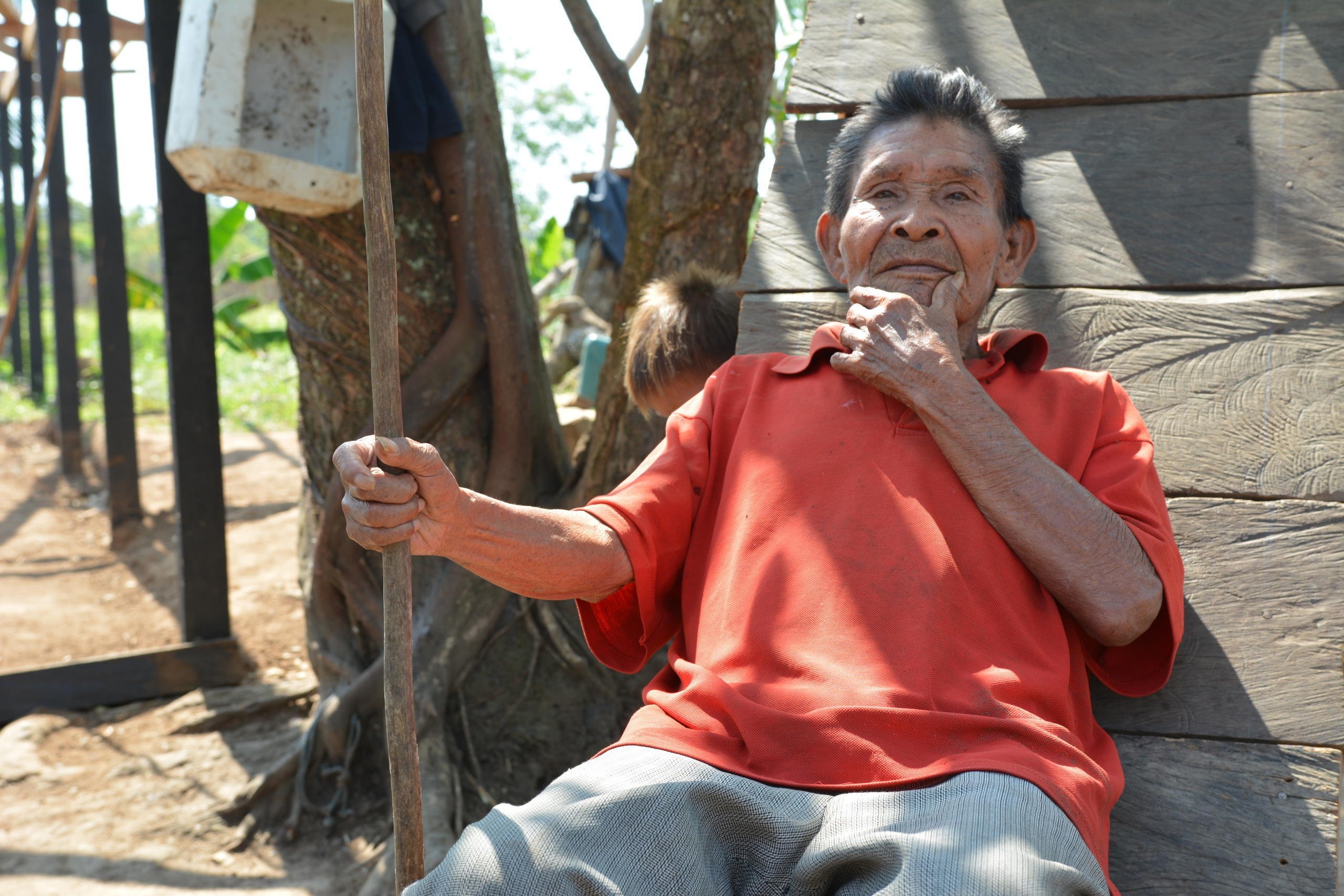 Vicente (76) sits in the sun. He explains the merits of the handmade basket his people have made for generations. It’s his job to teach his great grandson Andreas to make traditional handicrafts.

“All young people must learn,” he says. “They should all learn as I did before.”

But many of the old handicrafts that are traditional to the Jiw are dying out. The community has been uprooted from its ancestral land time and again because of the conflict. With each displacement, a little of their unique culture and traditions are lost. 

In 2009, the Government classified the Jiw as one of the country’s 30 endangered tribes.

Forty years displaced
Some of the 17 families in this small community in El Salado have been displaced by violence since 1970.

Vicente, his daughter Luzdary (66) and Andreas are three generations of Jiw that have finally returned to their ancestral lands. They are part of a group that the Norwegian Refugee Council has helped to return to a place they can finally call home. 

Traditionally a hunting tribe, Andreas proudly shows off a spear he uses for hunting. 

“There are fewer animals nowadays than before though, and the men in the community must walk up to 8 hours when they go to hunt meat to feed the community,” says Andreas.

Andreas wants to work with computers when he finishes school. “People who work on computers make more money,” he laughs.

Vicente recognizes that the numbers of their people are falling. “Some families were as big as 50 people before,” he recalls. “But now are as small as 30. They left for the towns.”

Neglected communities
A peace deal signed in Colombia in 2016 paved the way for the country to rebuild, after the decades-long war. 

International organizations are keen to support, and funding is coming in for development projects like strengthening peace. However, small communities like the Jiw who are in humanitarian need have been somewhat neglected. 

Building a future
The Norwegian Refugee Council has been working with the Jiw Community in the Guaviare region since September 2015. We are helping to rebuild homes for hundreds of displaceden, women and children returning to their ancestral lands. We provide free legal counseling so that people know their rights on land issues. We also support children to return to school.

Date: February 2017
Photo credit: NRC / Michelle Delaney
Text: michelle.delaney@nrc.no