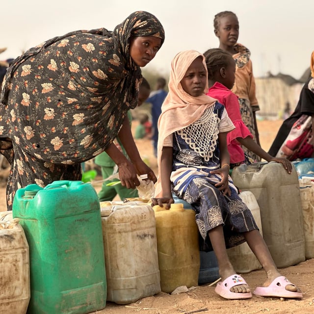 People in line for water.
