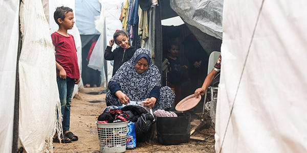 A family in Gaza outside their tent.