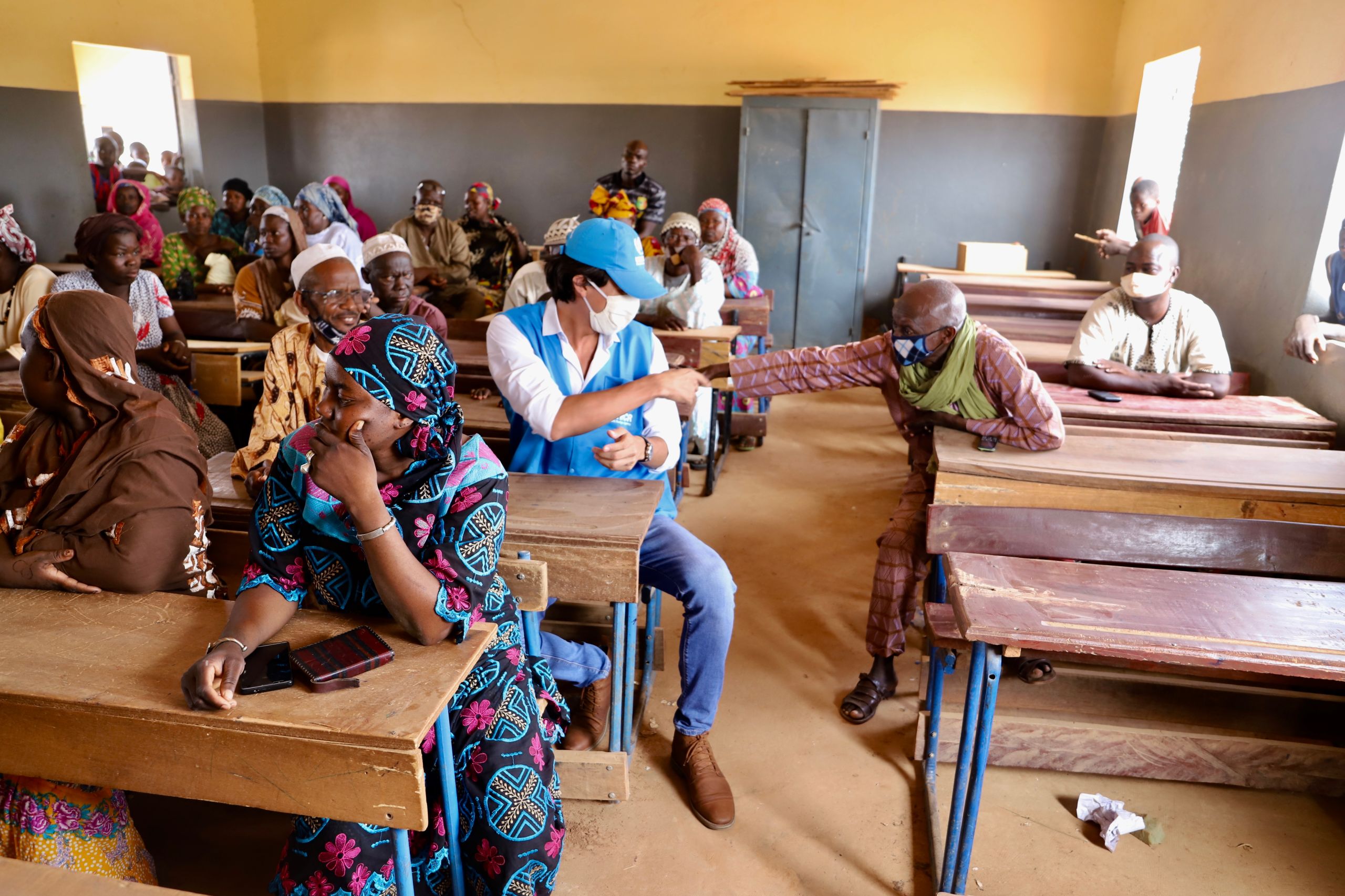 NORCAP education expert Leandro Salazar-Liévano interacting with parents of children in a classroom in Mopti, Mali.