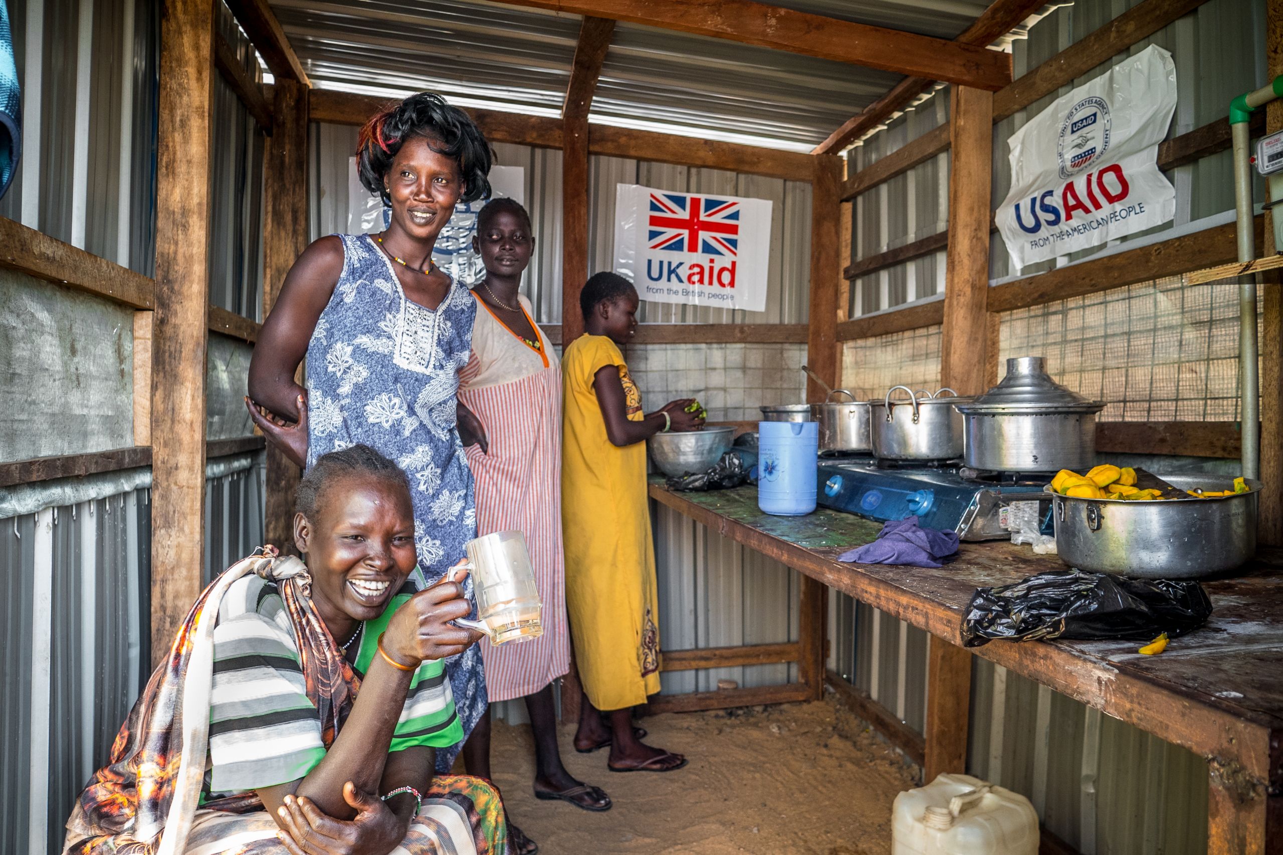 Women cooking in the newly restored biogas fueled communal kitchen in the refugee camp of Malakal, South Sudan. It took some time adjusting to the thought of cooking by using human waste, says energy expert Geophrey Oyugi, but in the end the locals seem pleased with the result