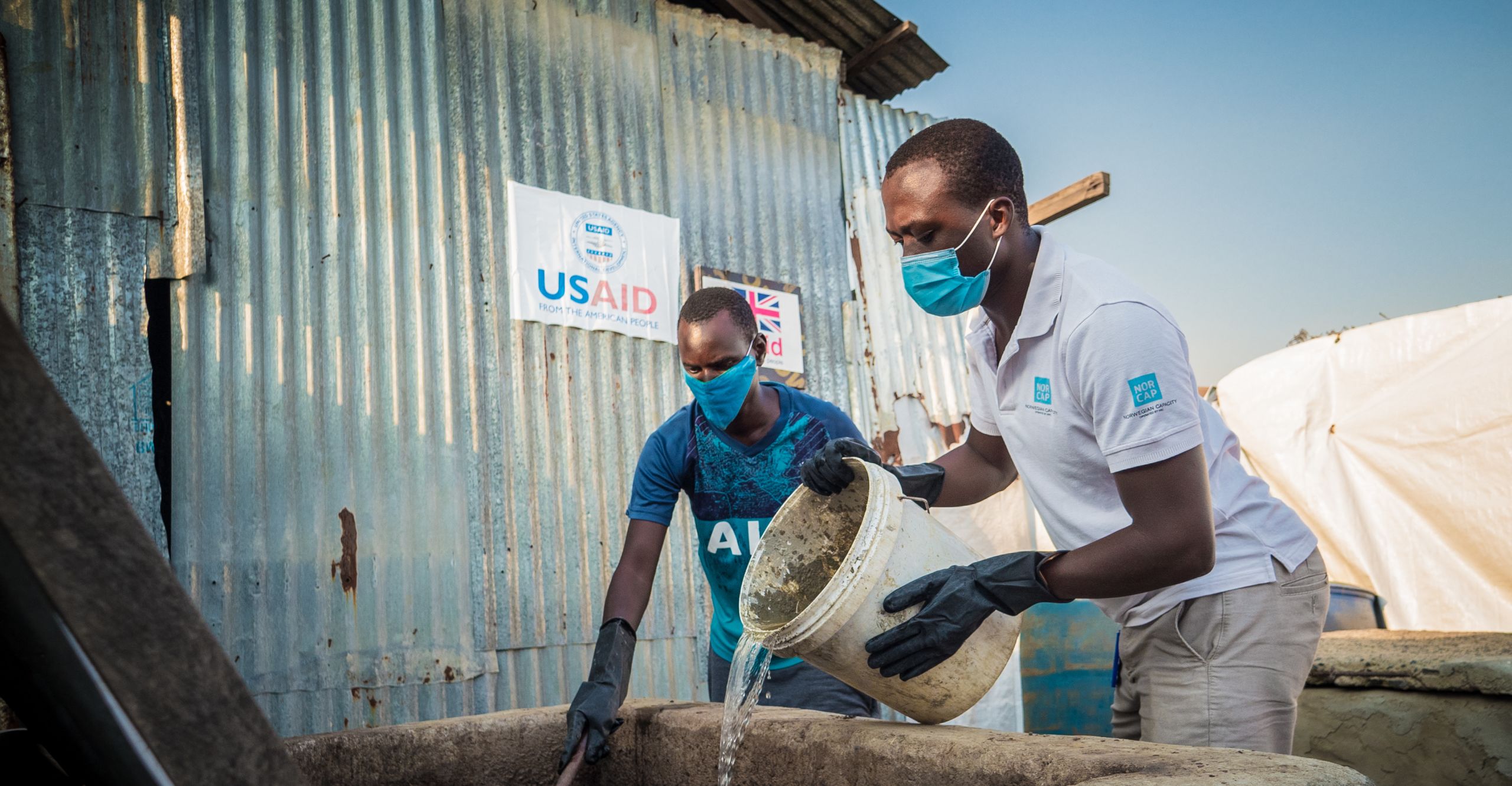 Energy expert Geophrey Oyugi transforming latrine waste into biogas for cooking, in Malakal refugee camp, South Sudan. (Photo: Iban Colon)