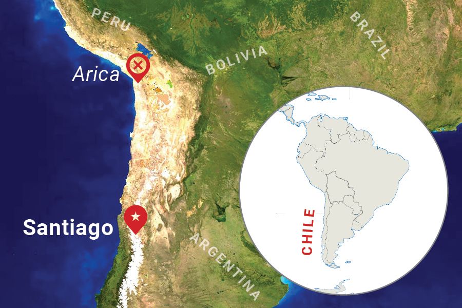 Map of Chile, with pins in Arica and Santiago.