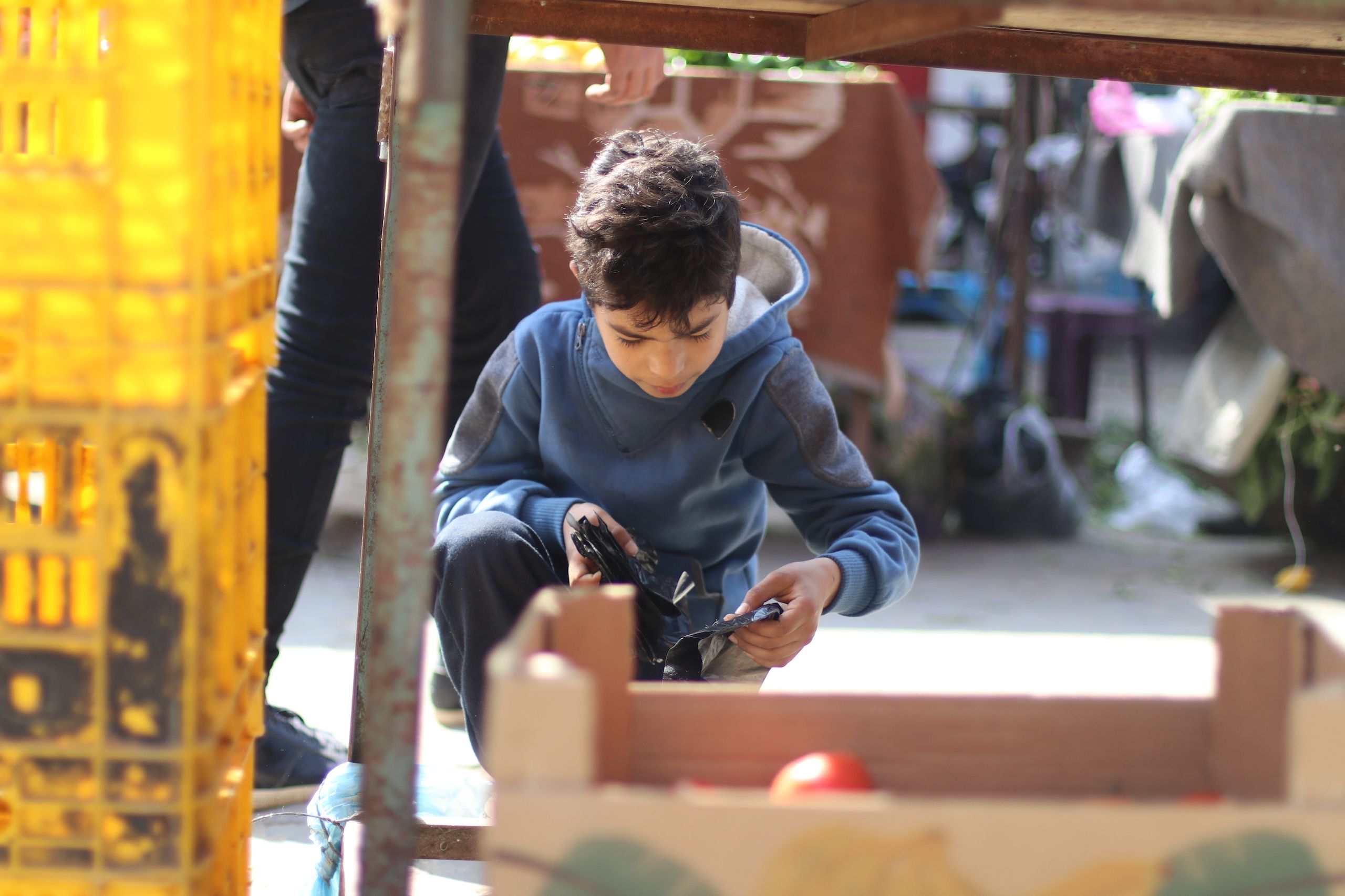 A child looking for plastic.