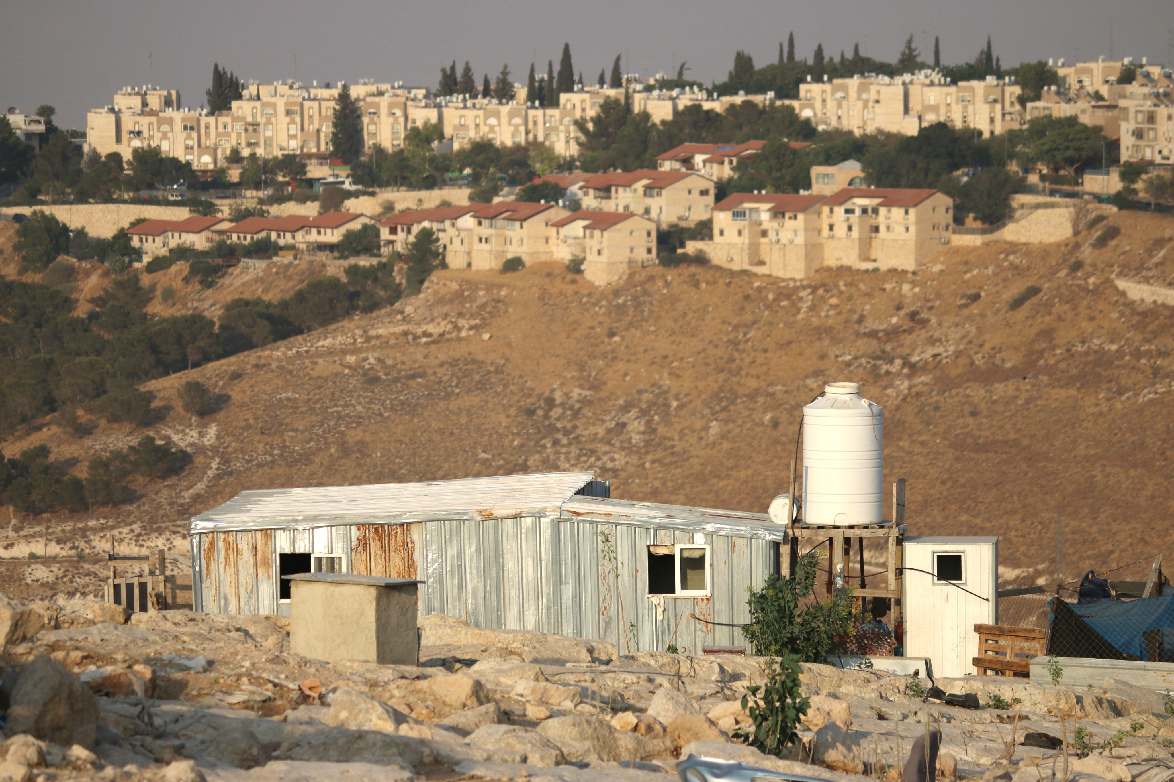 A small house in a dry landscape.