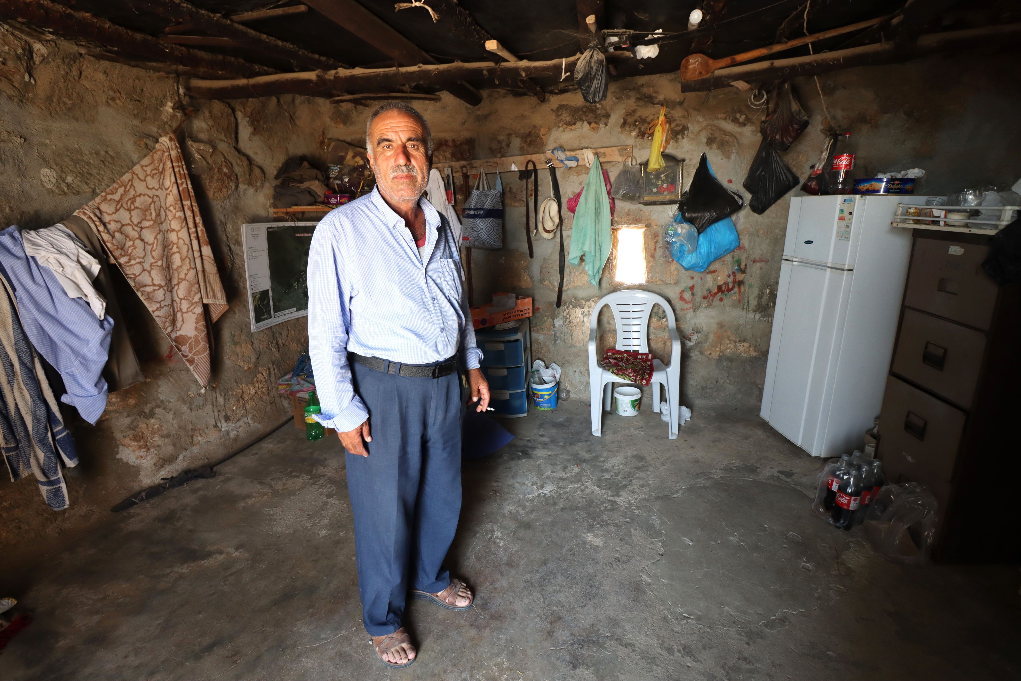A man standing in his home.